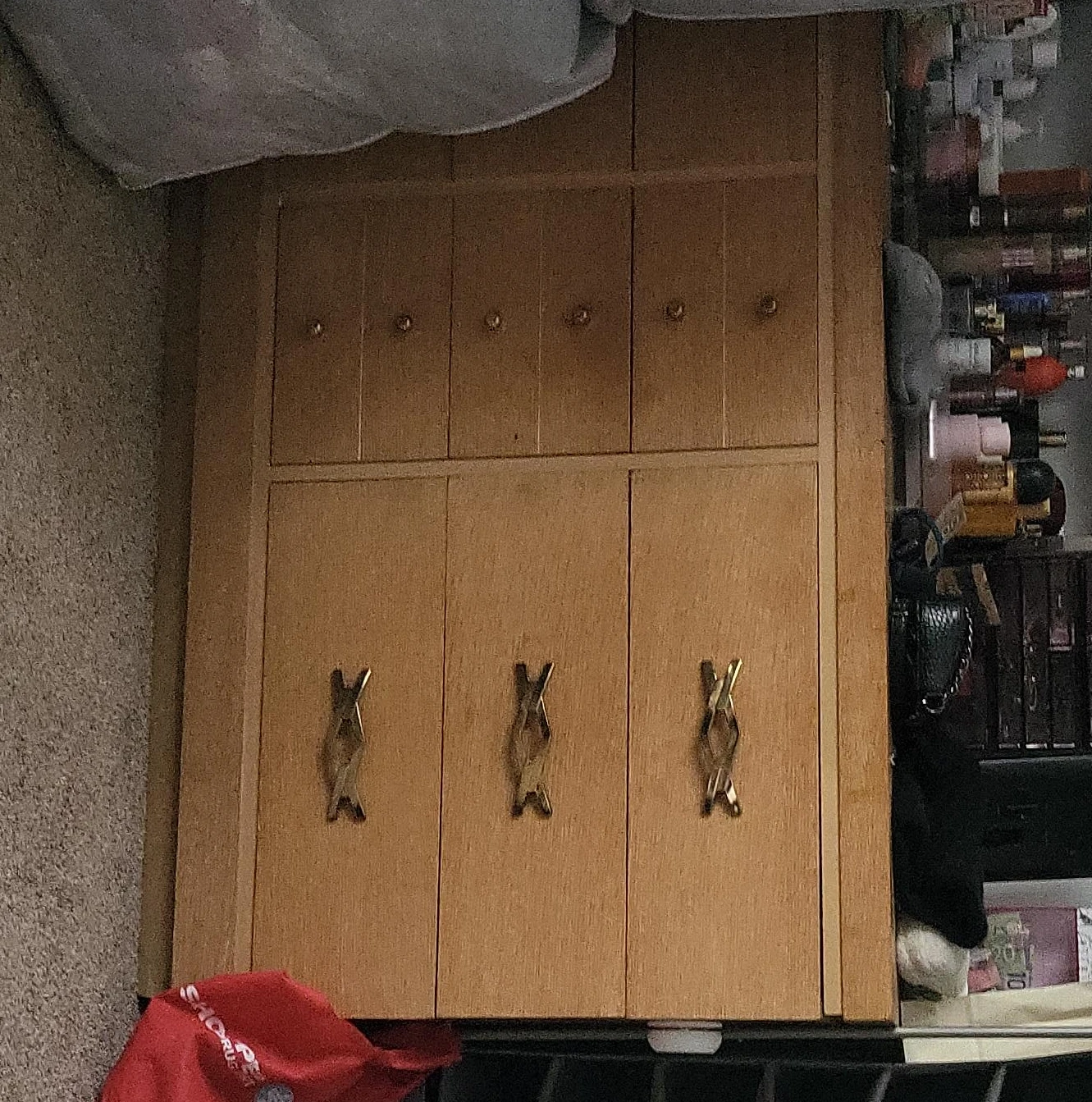 Wooden wardrobe with gold handles