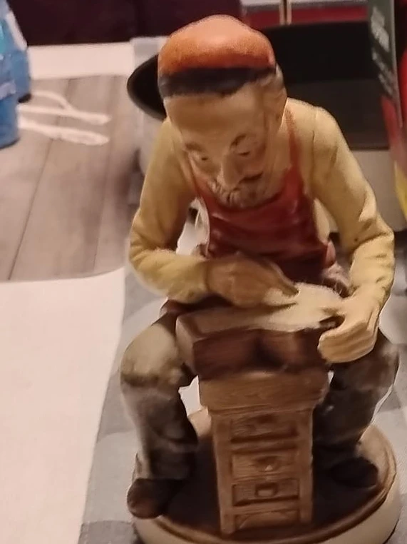 Vintage Porcelain Figurine of a Craftsman