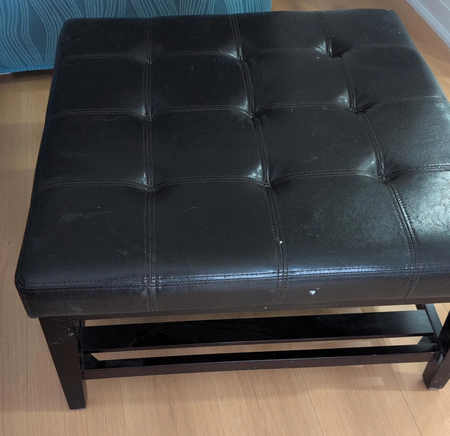 Black Tufted Storage Ottoman as a coffee table pick up as