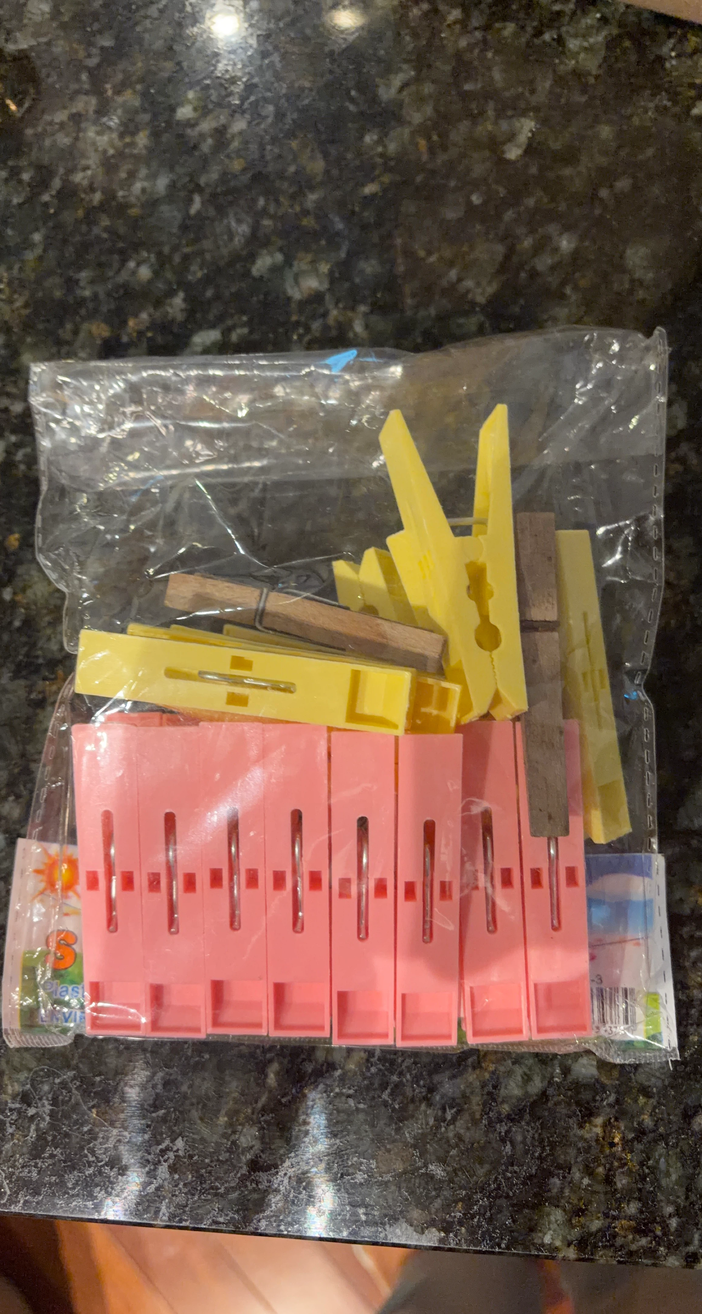 Plastic and wooden clothing pegs