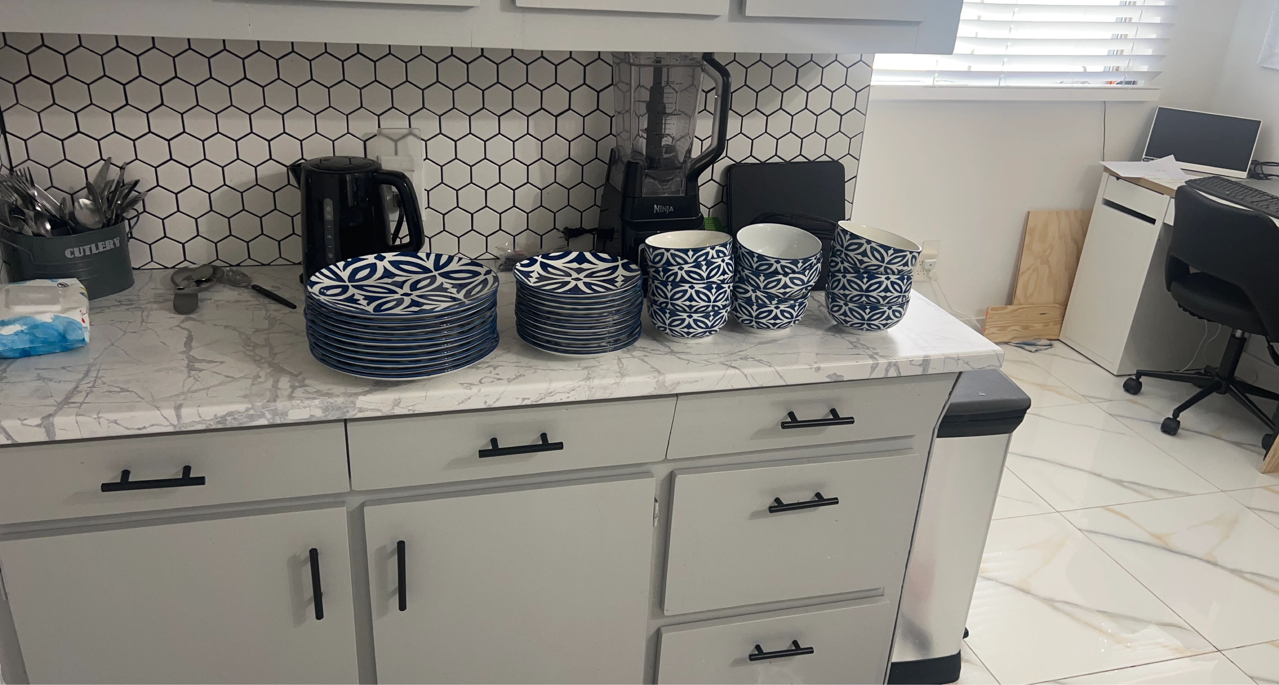 Blue and White Patterned Plates and Mugs Set