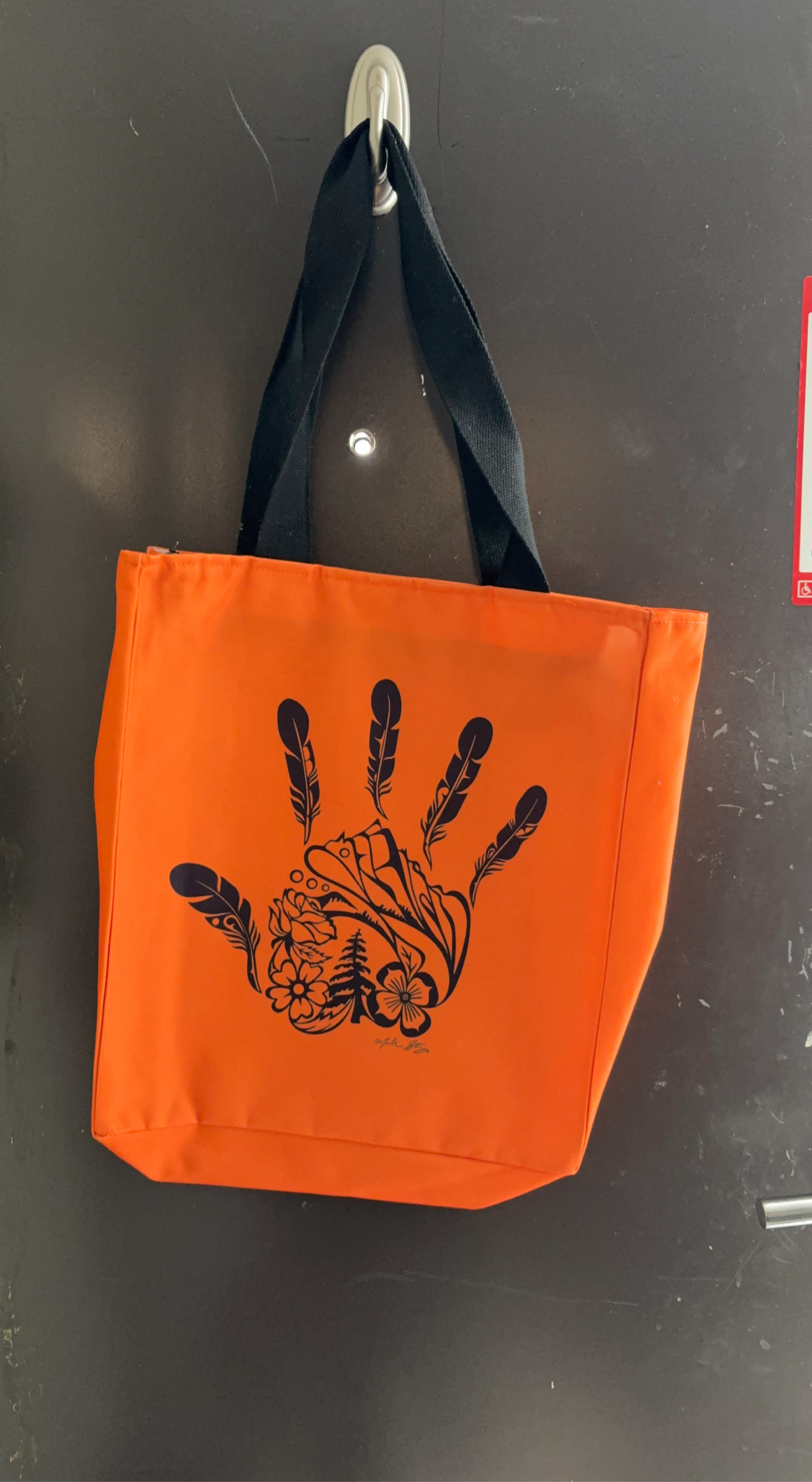 Orange Tote Bag with Hand and Feather Design