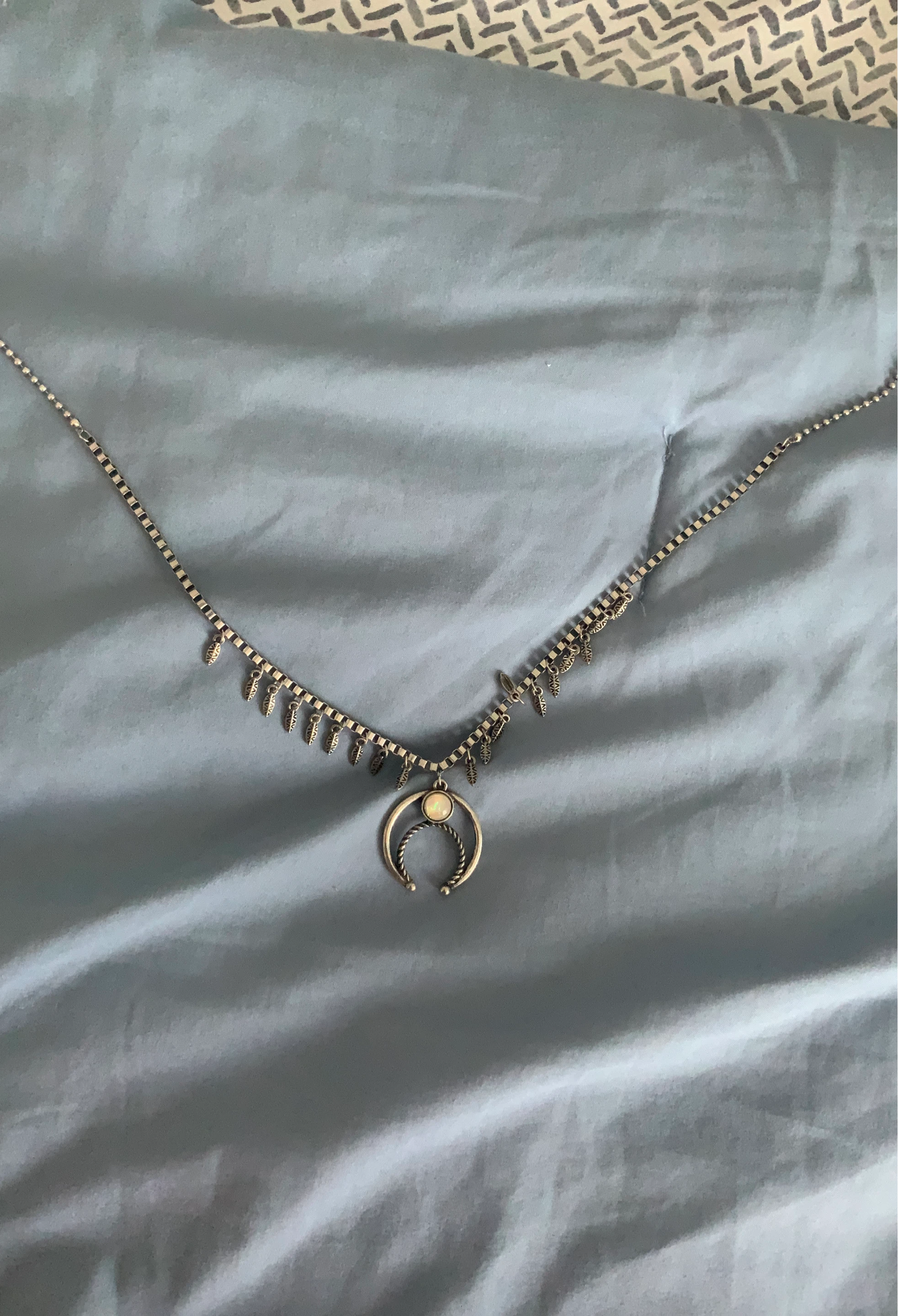 Silver necklace with crescent moon pendant