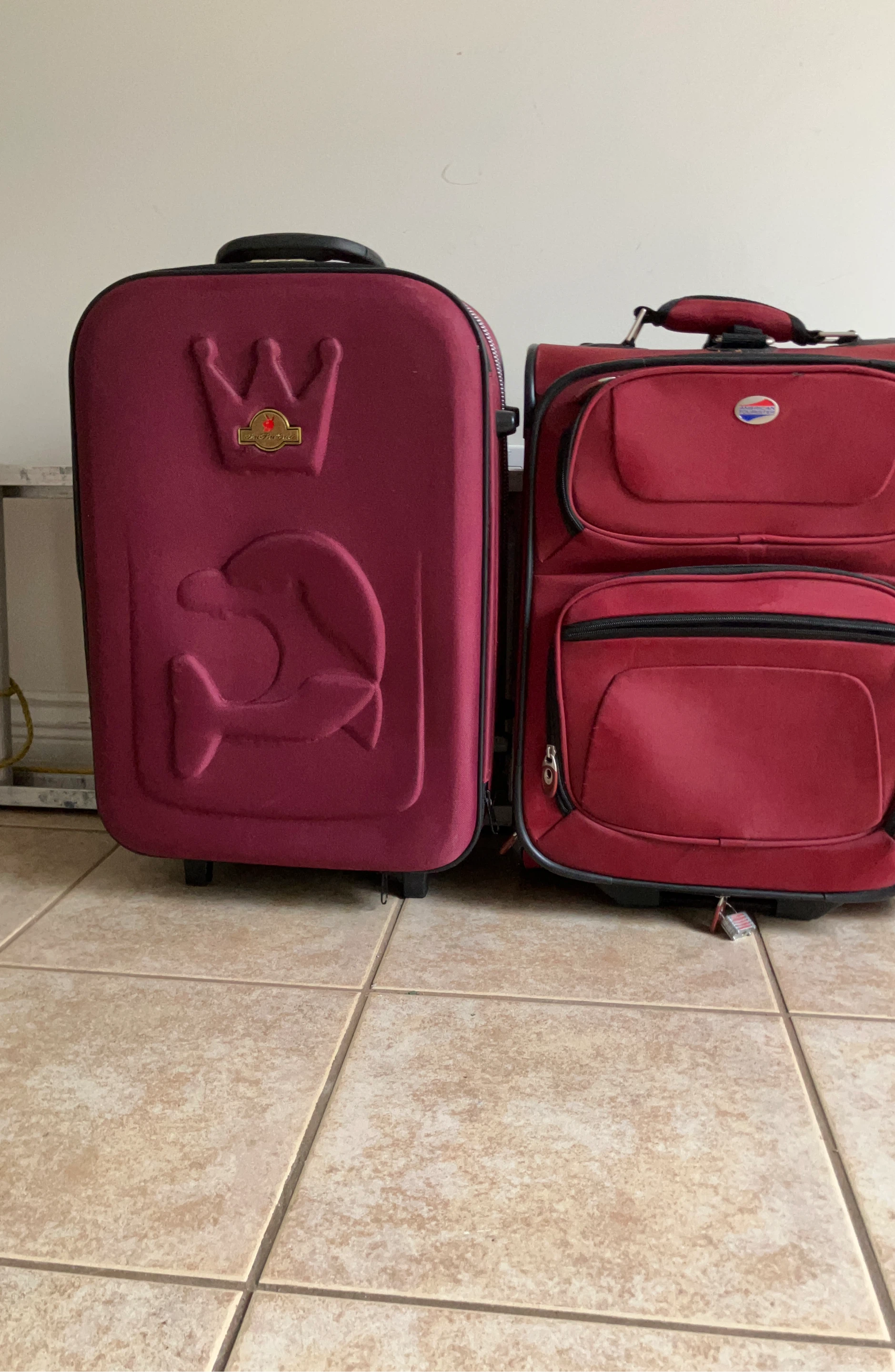 Two red suitcases