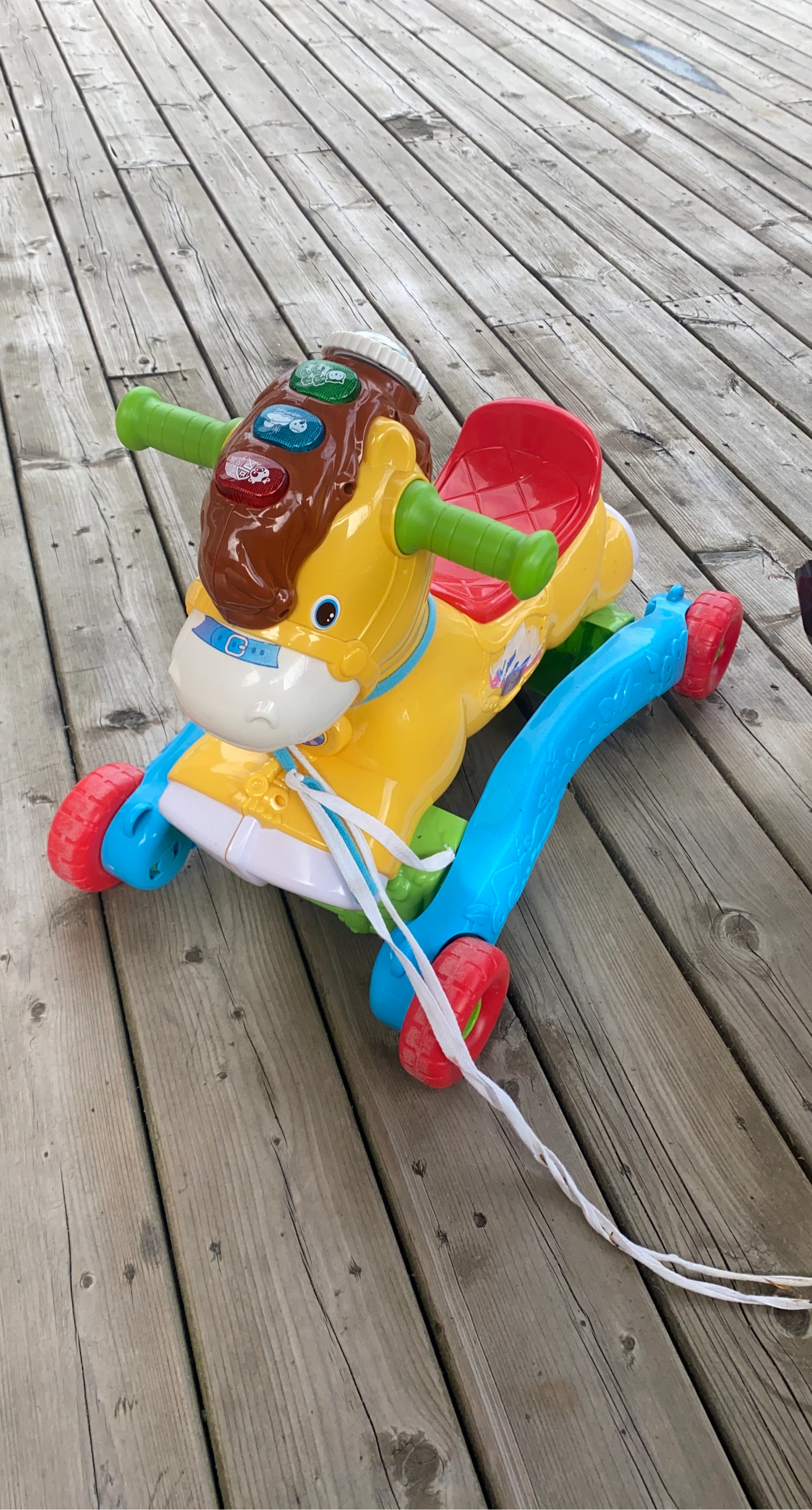 Yellow and Blue Ride-On Horse Toy with Red Seat