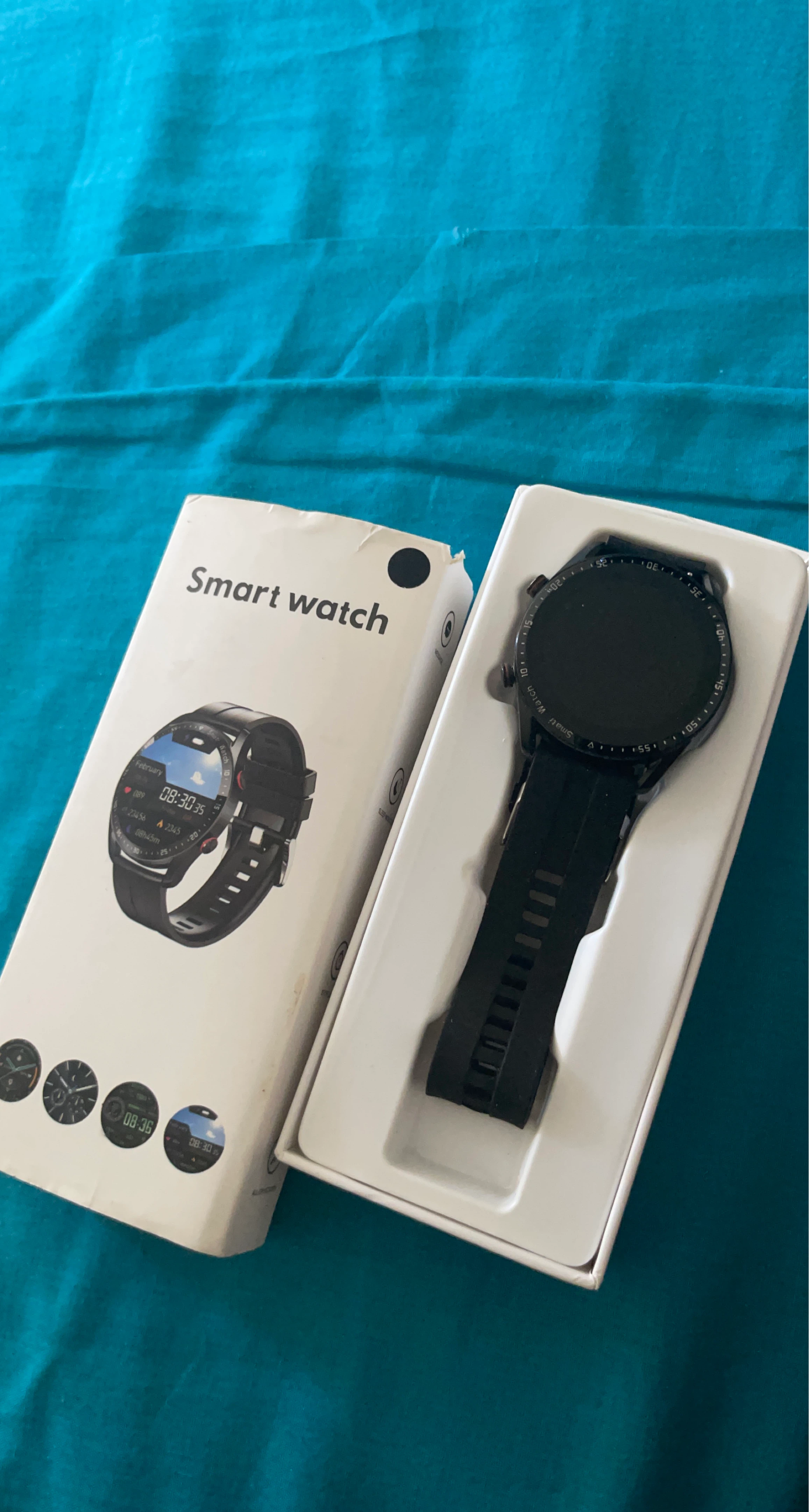 Black Smart Watch with Charging Cable and Extra Band