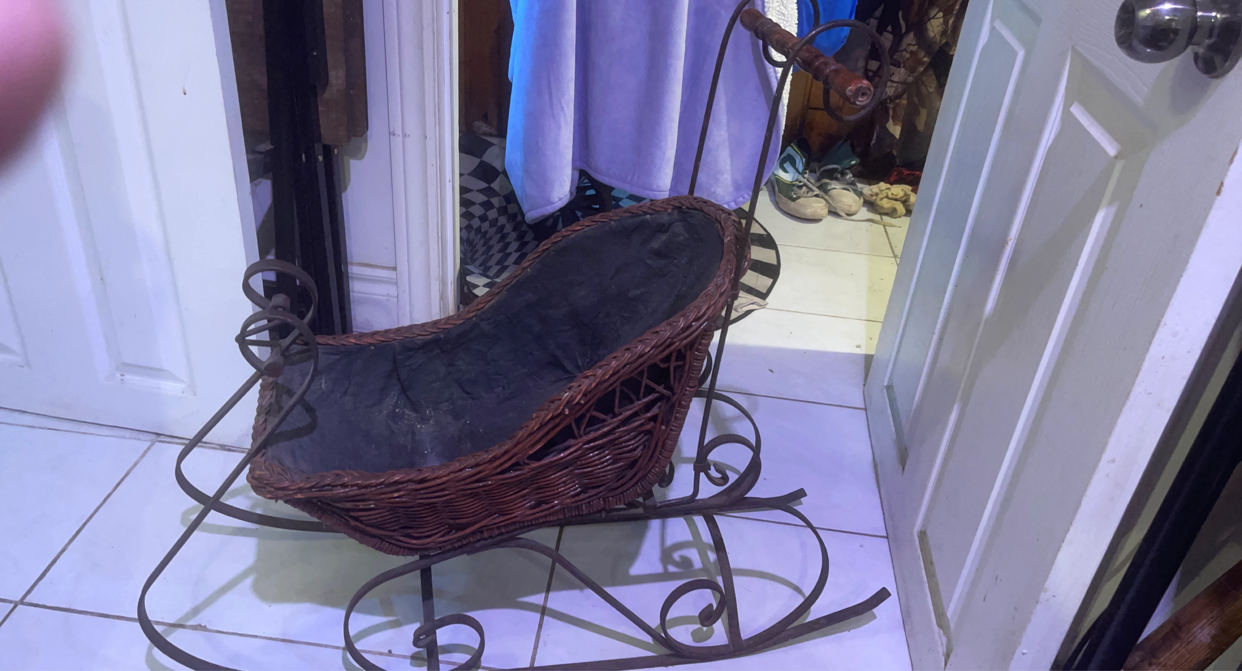 Vintage wicker and metal rocking carriage