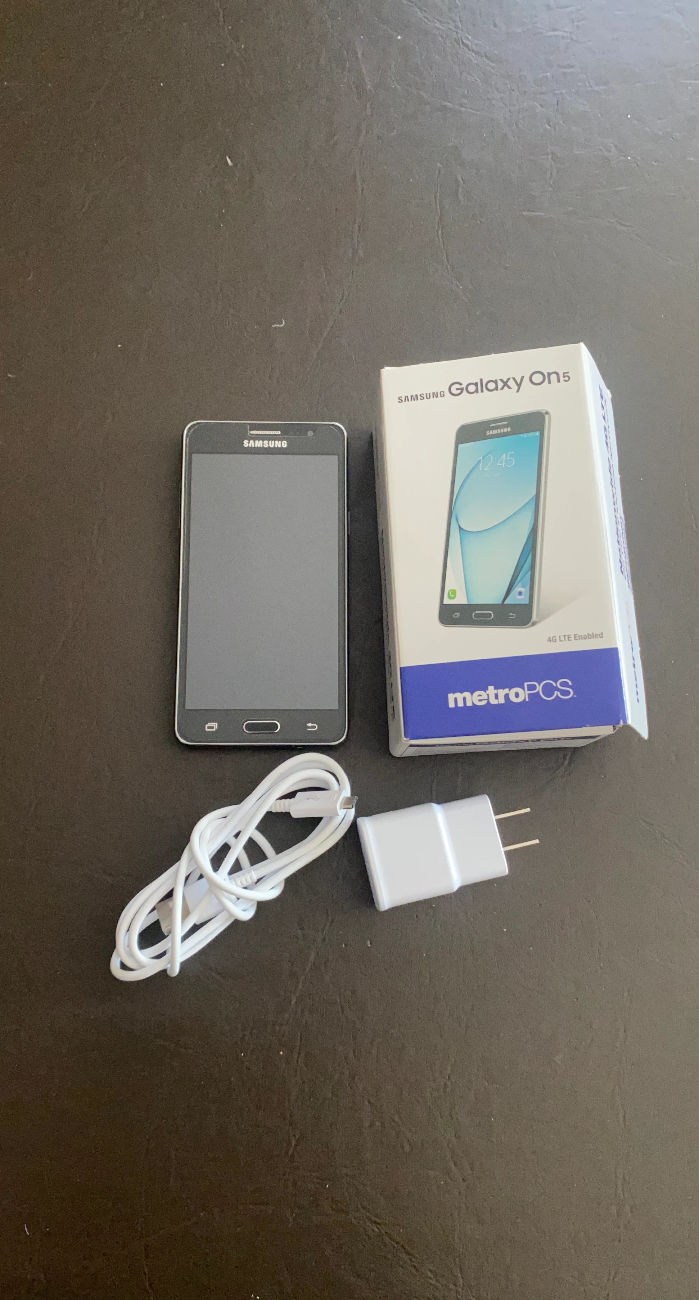 Samsung Galaxy On5 Smartphone with Charger and Cable