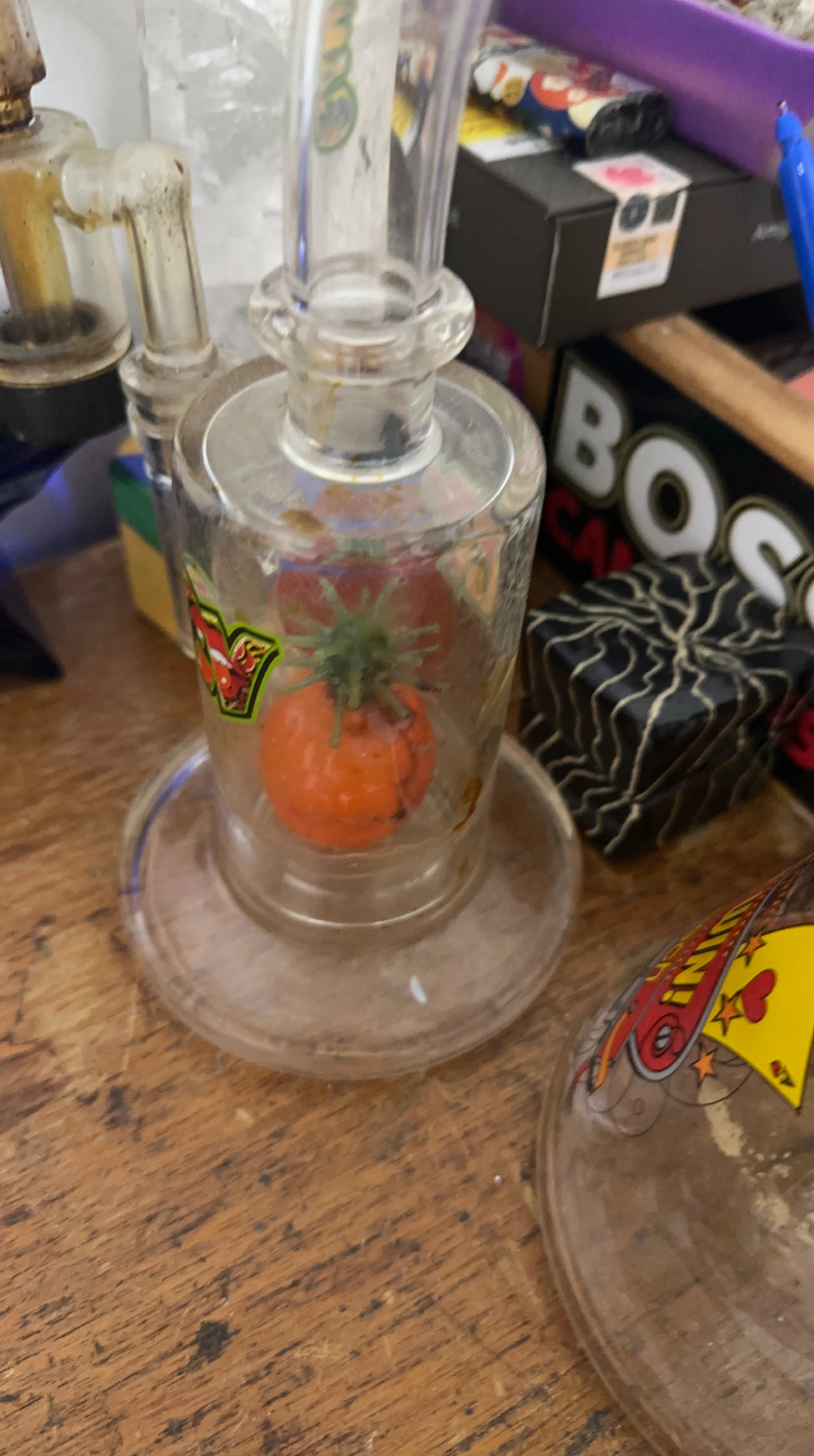 Glass bong with tomato accent