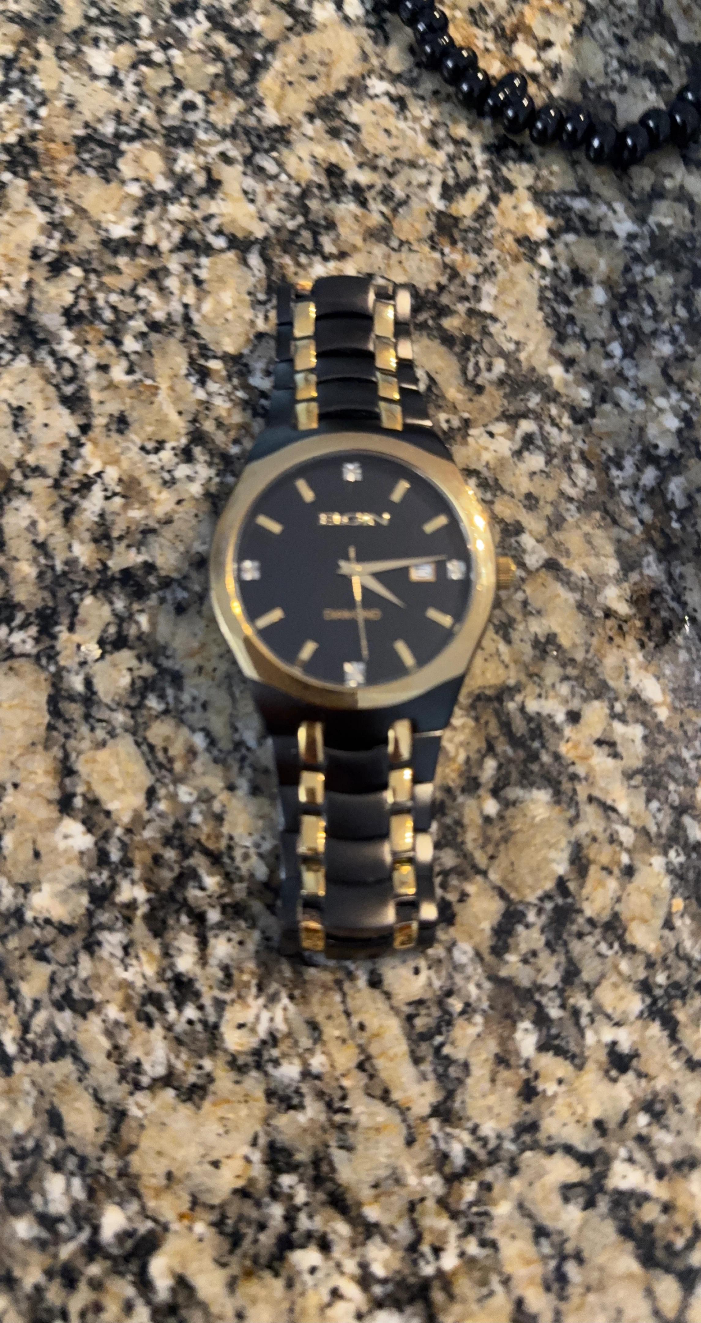 DKNY Women's Gold and Black Diamond Watch