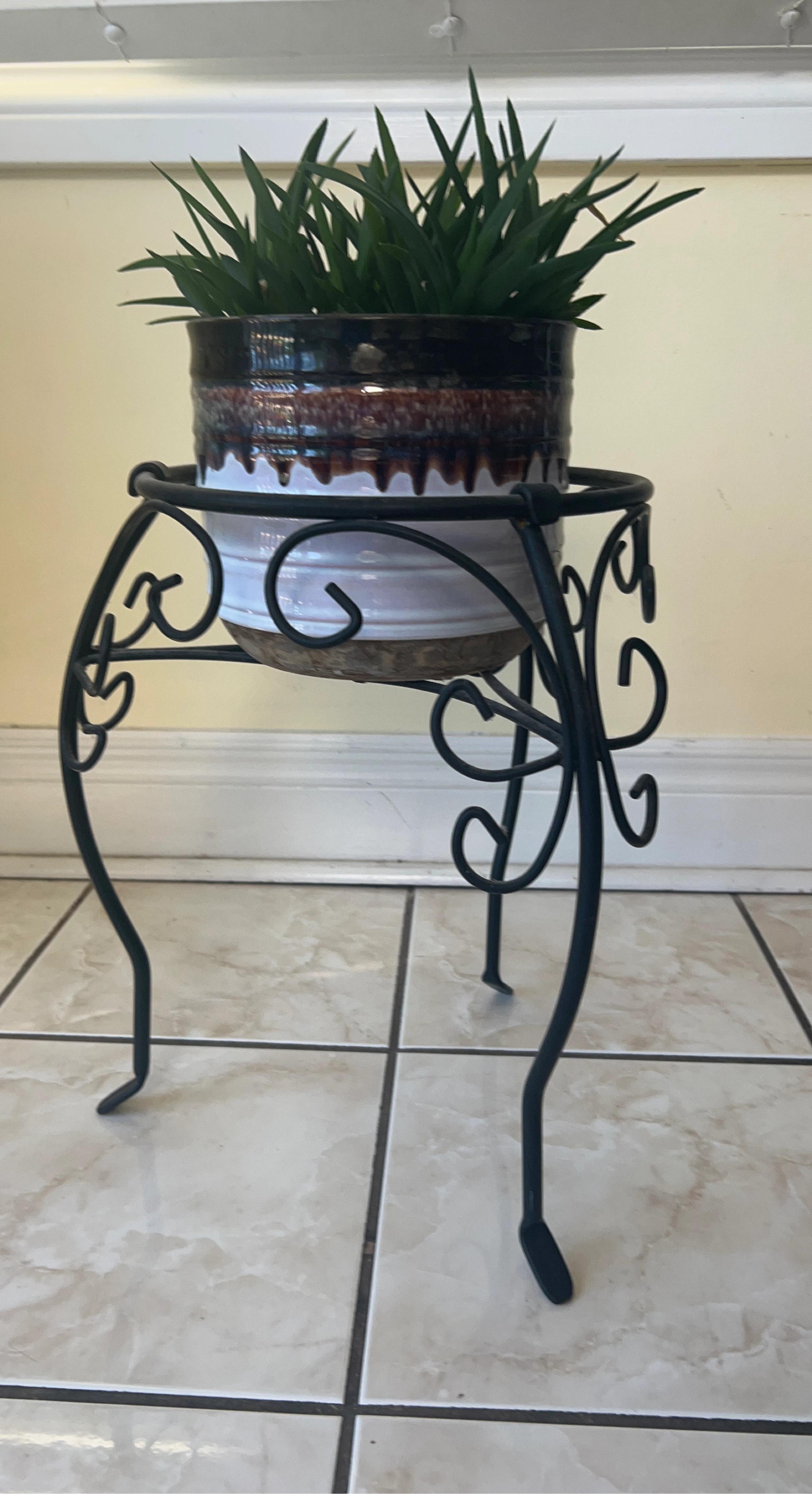 Black Metal Plant Stand with Decorative Scrollwork