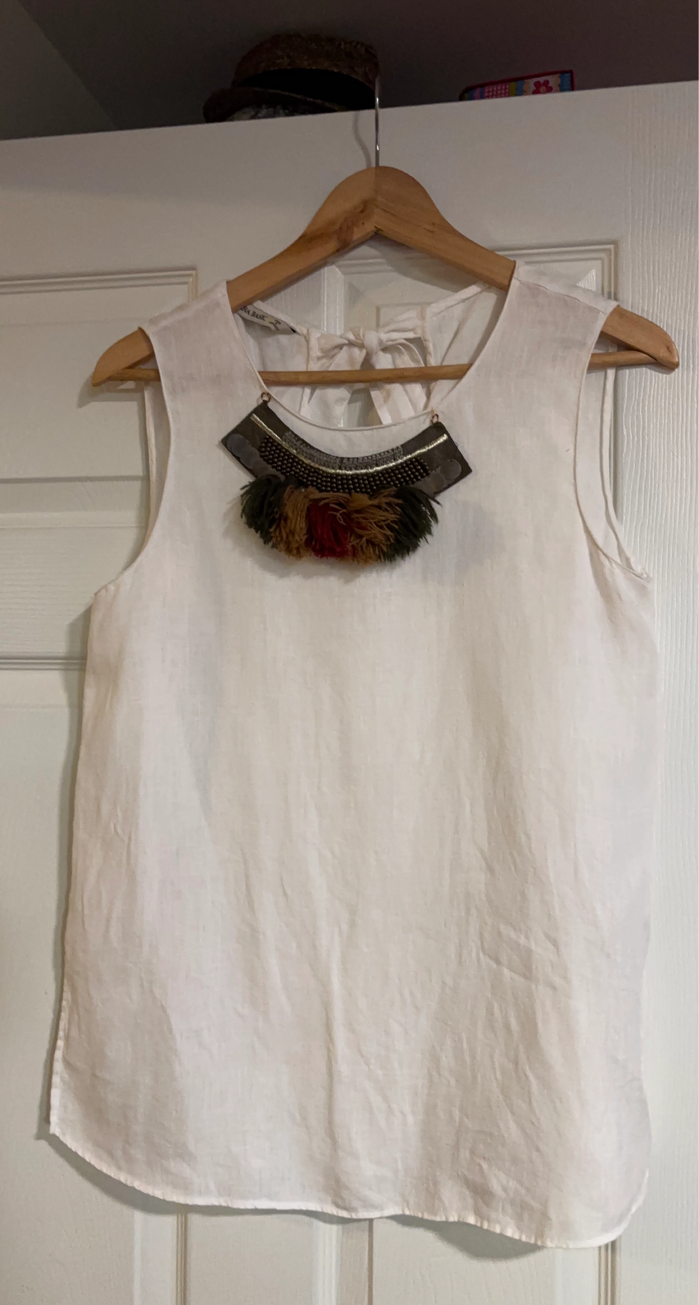 White Sleeveless Top with Embellished Neckline