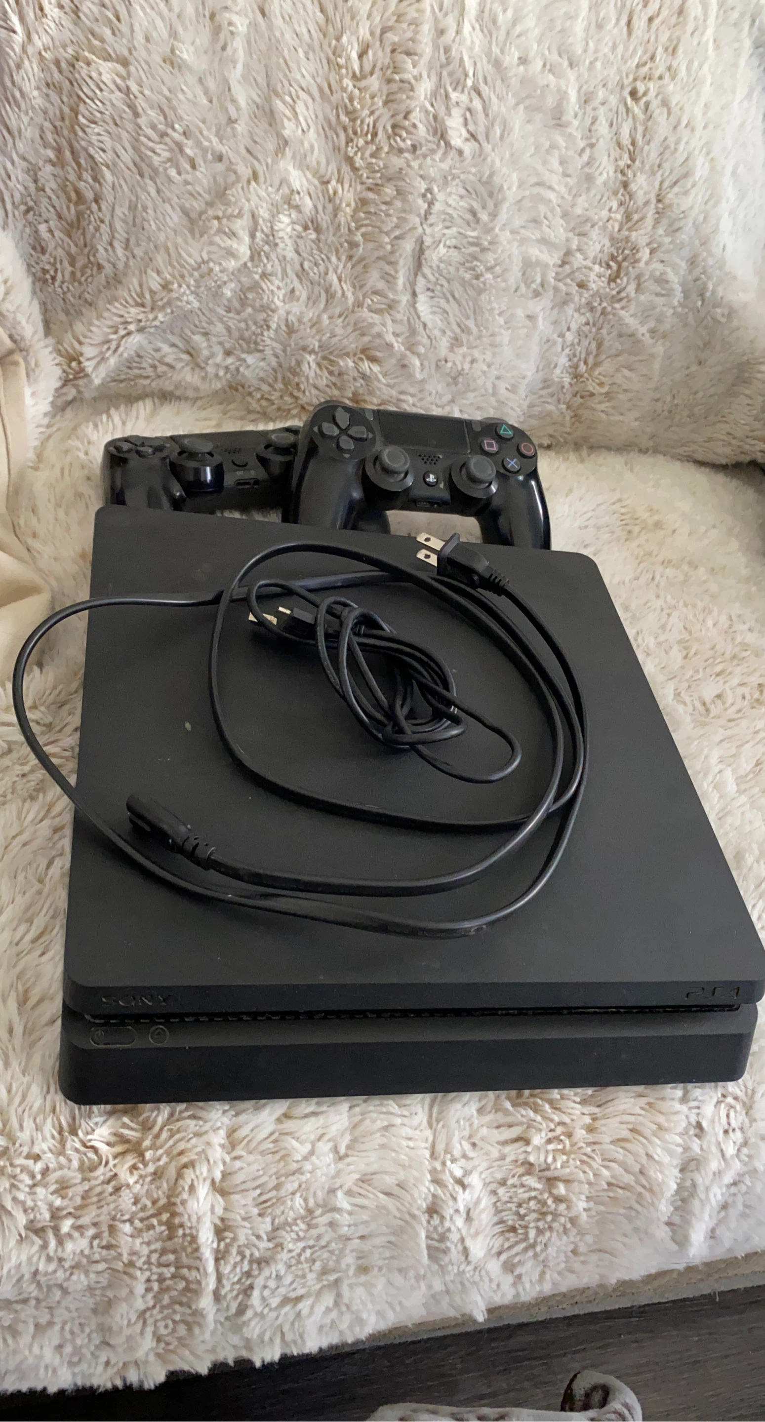 Sony PlayStation 4 Slim Console with 2 Controllers