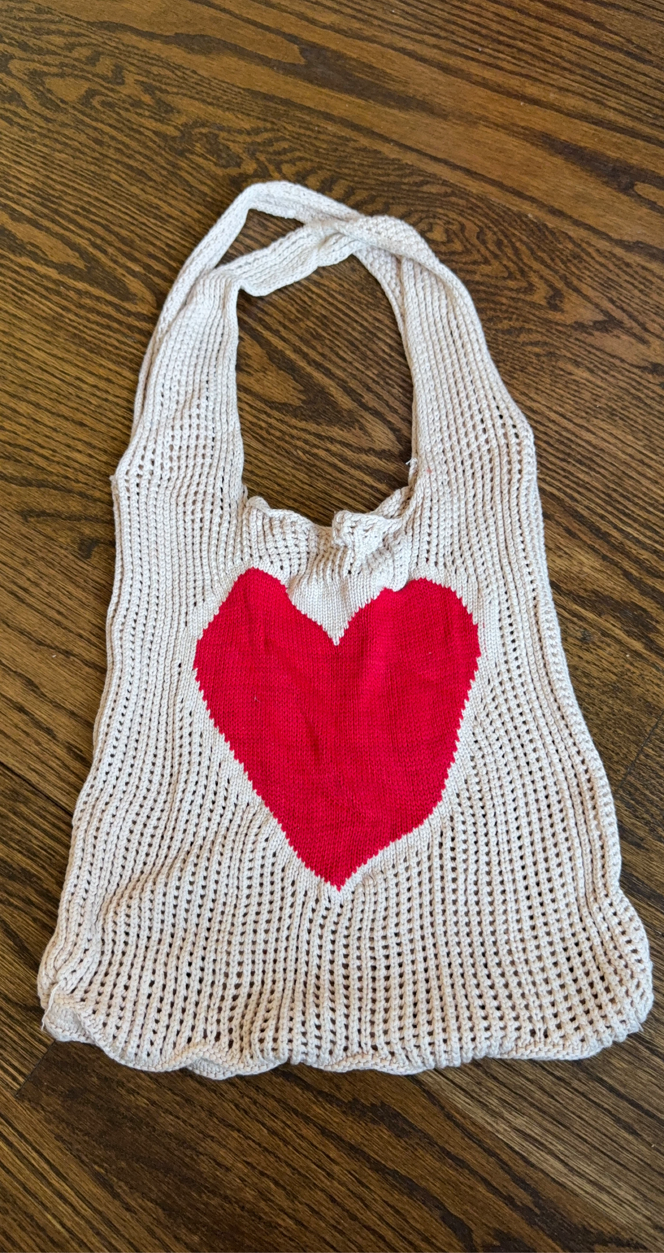 Hand-knitted tote bag with red heart design
