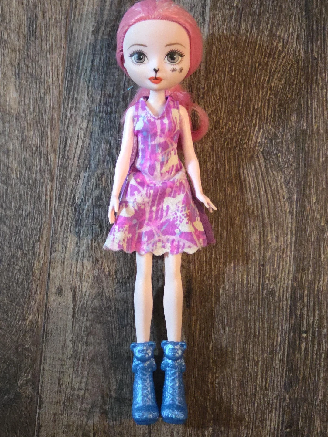 Doll with pink hair and purple dress