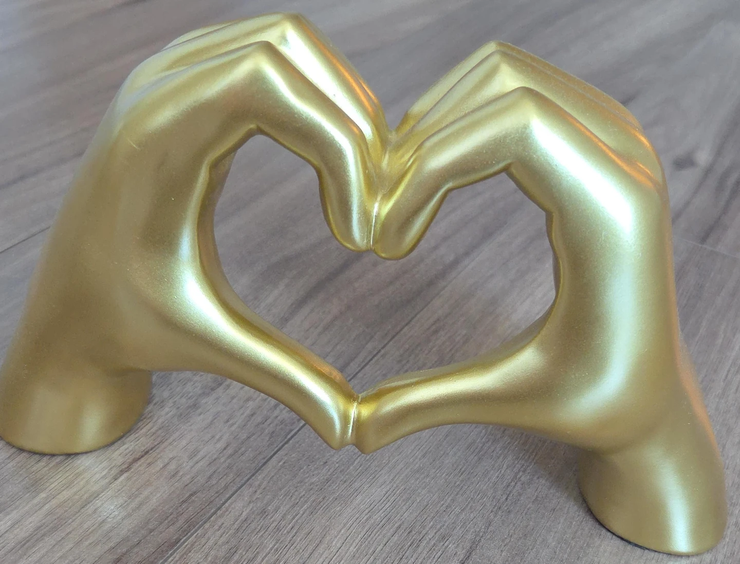 Gold Hand Heart Sculpture