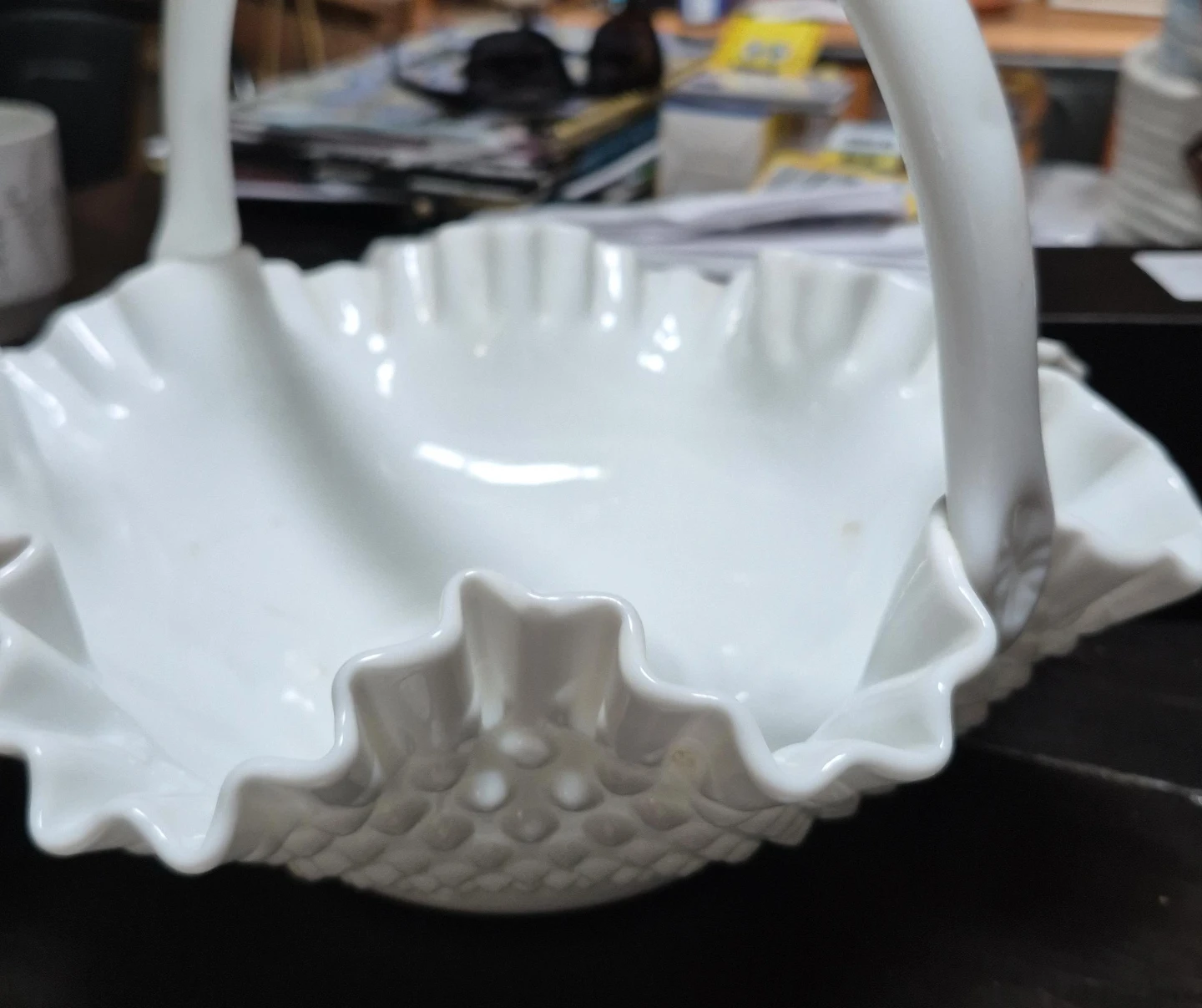 White hobnail milk glass basket with ruffled edge and handle