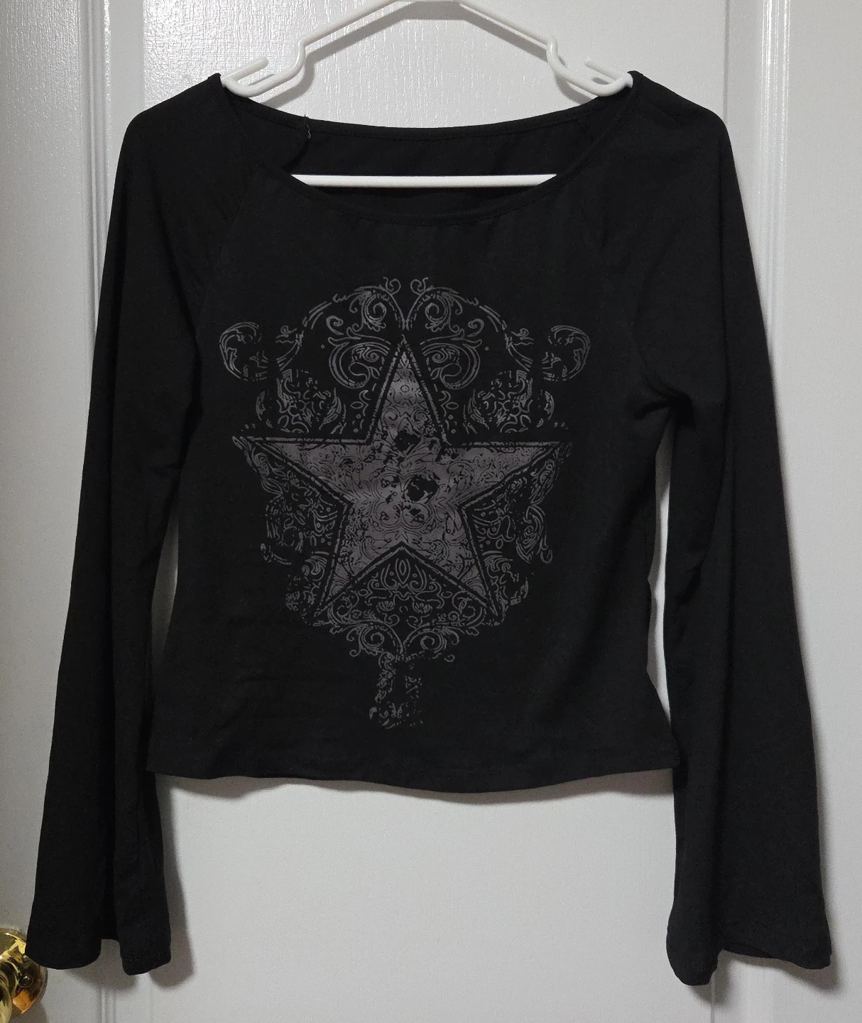 Black long-sleeve shirt with star graphic