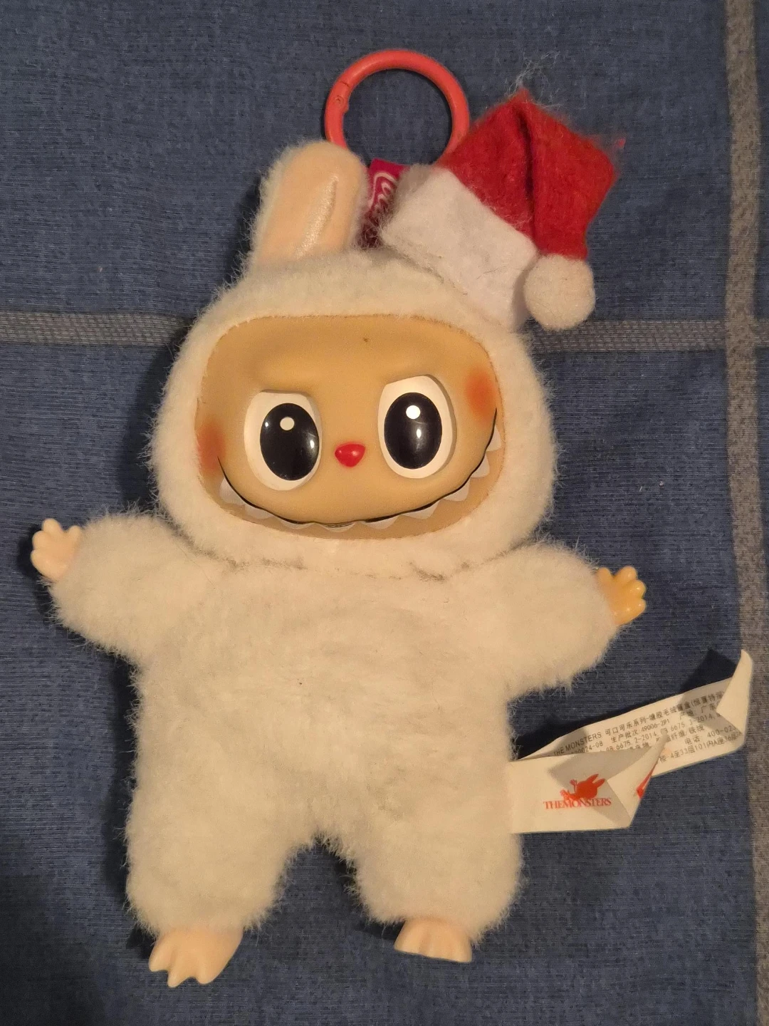 Labubu plush toy with Santa hat
