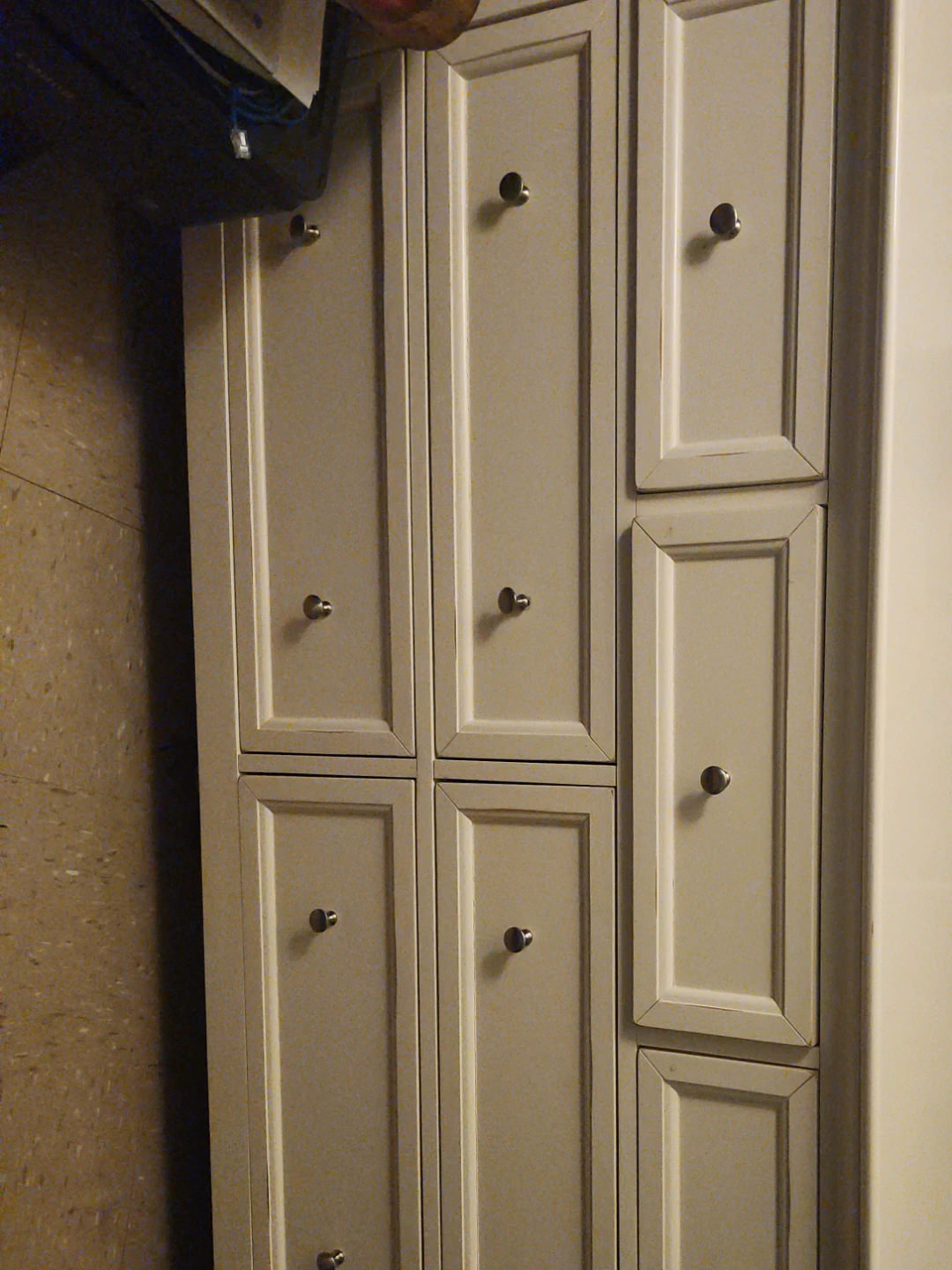 Tall storage cabinet with multiple doors