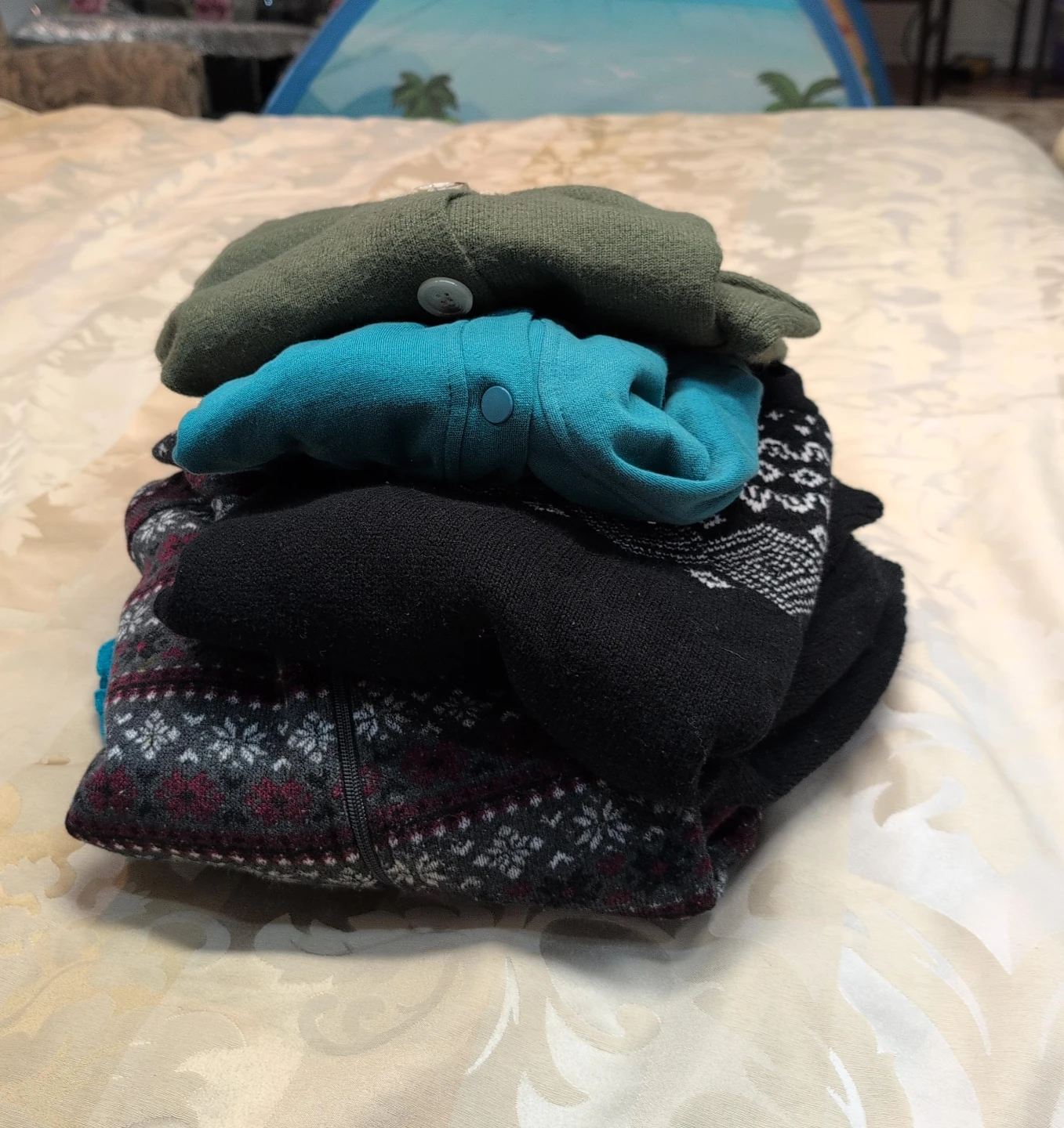 Set of 4 Assorted Sweaters$15