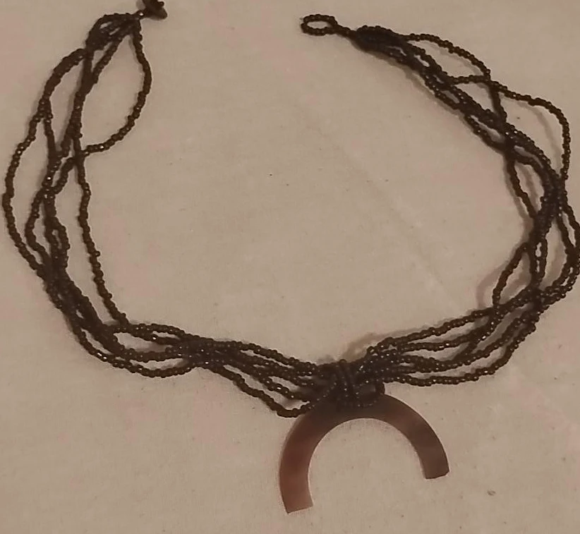 Beaded necklace with crescent moon pendant
