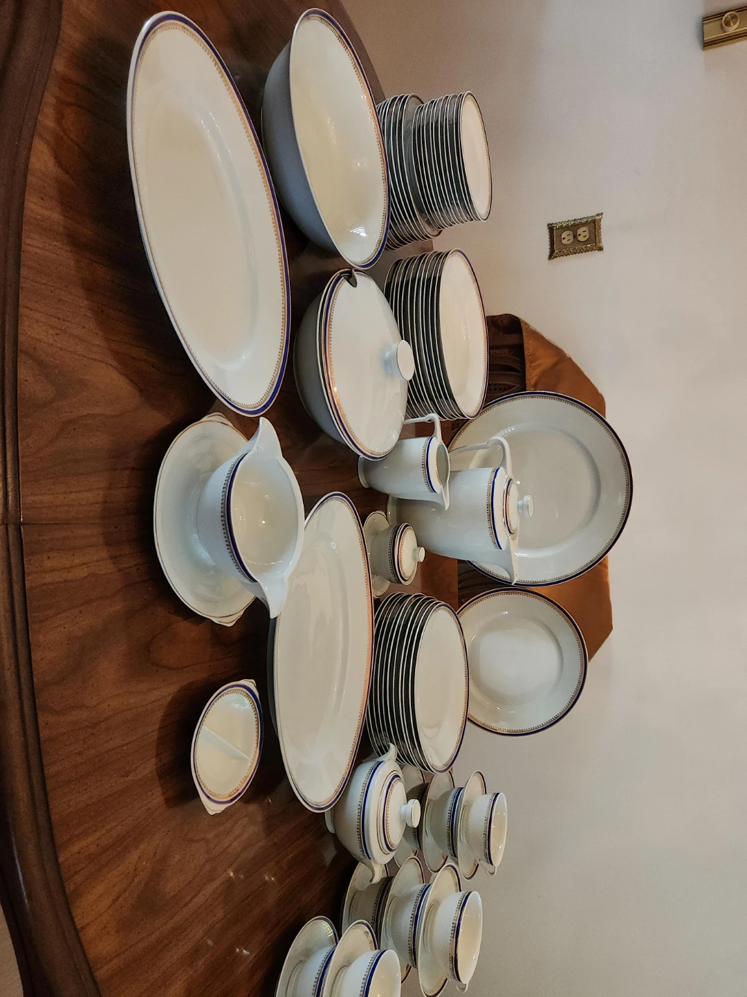 White Dinnerware Set with Blue and Gold Trim