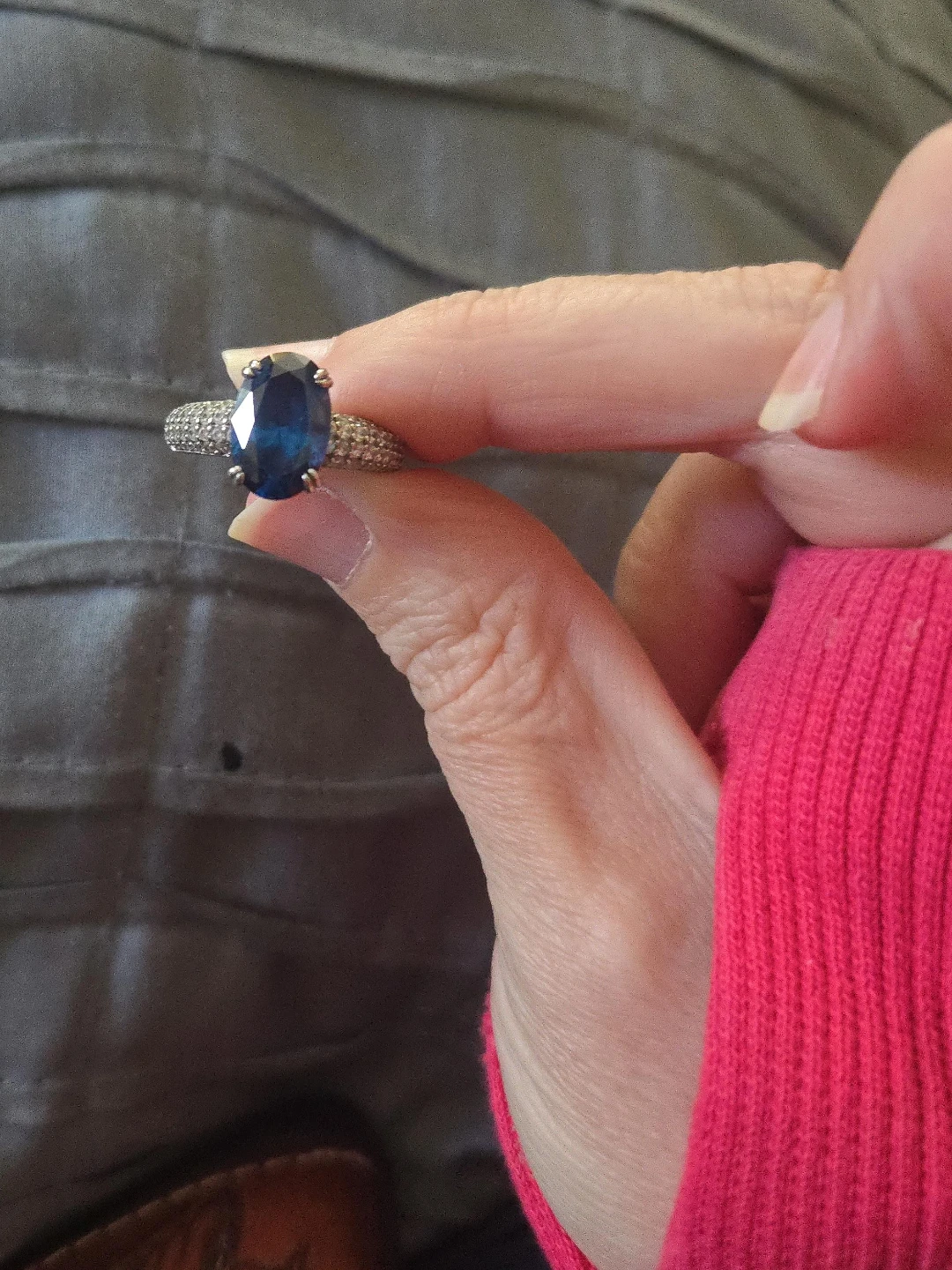 Oval Blue Gemstone Ring with Paved Band