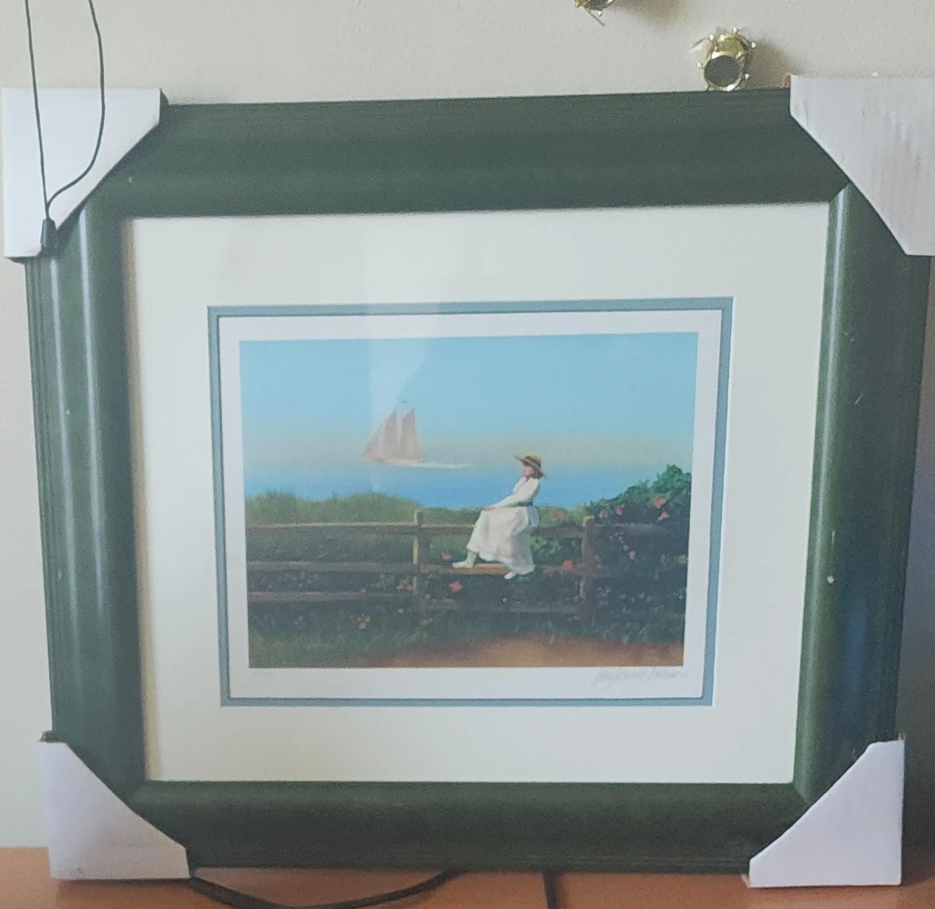 Framed Print of Woman by the Sea