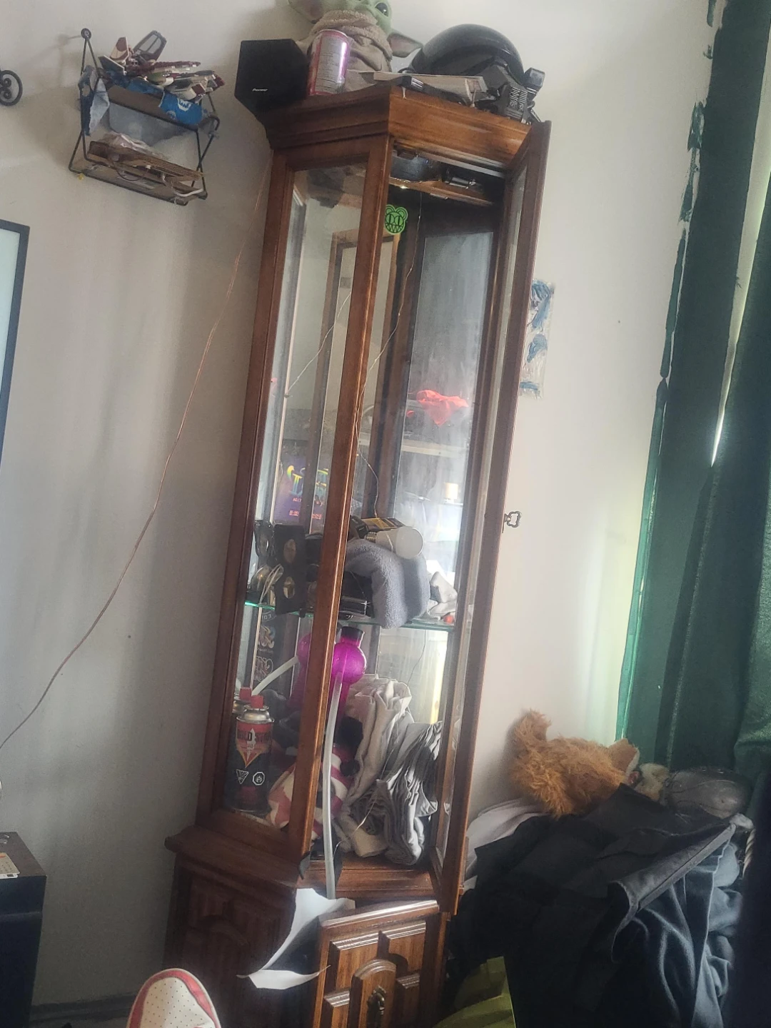 Wooden curio cabinet with glass doors