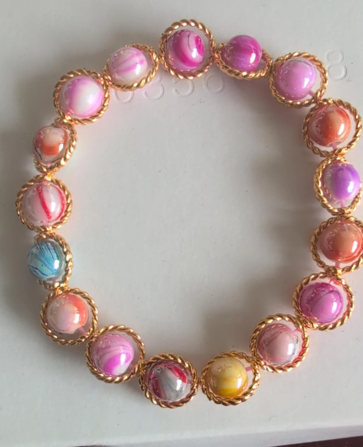 Multicoloured Beaded Bracelet with Gold Tone Wire