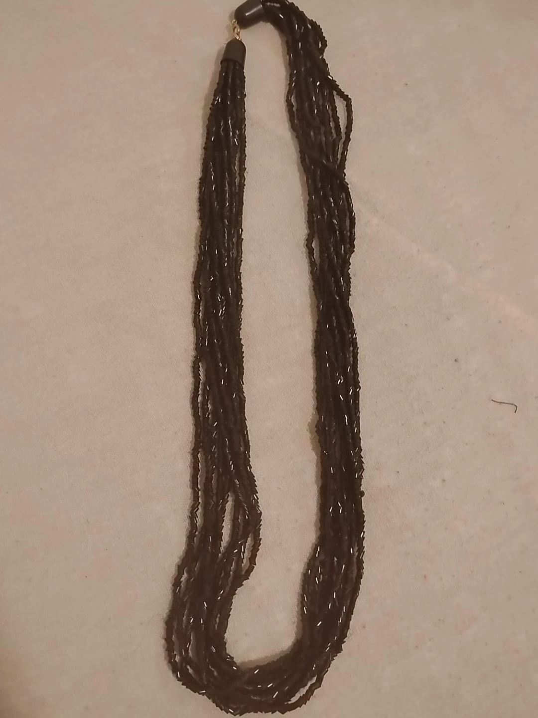Multi-strand dark beaded necklace