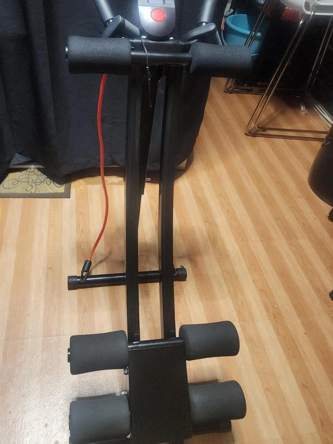 Black Fitness Ab Roller Machine with Red Resistance Band