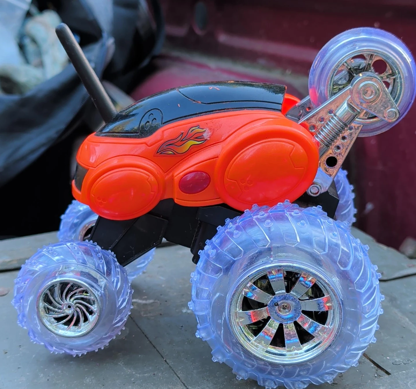 Orange RC Stunt Car with Transparent Wheels