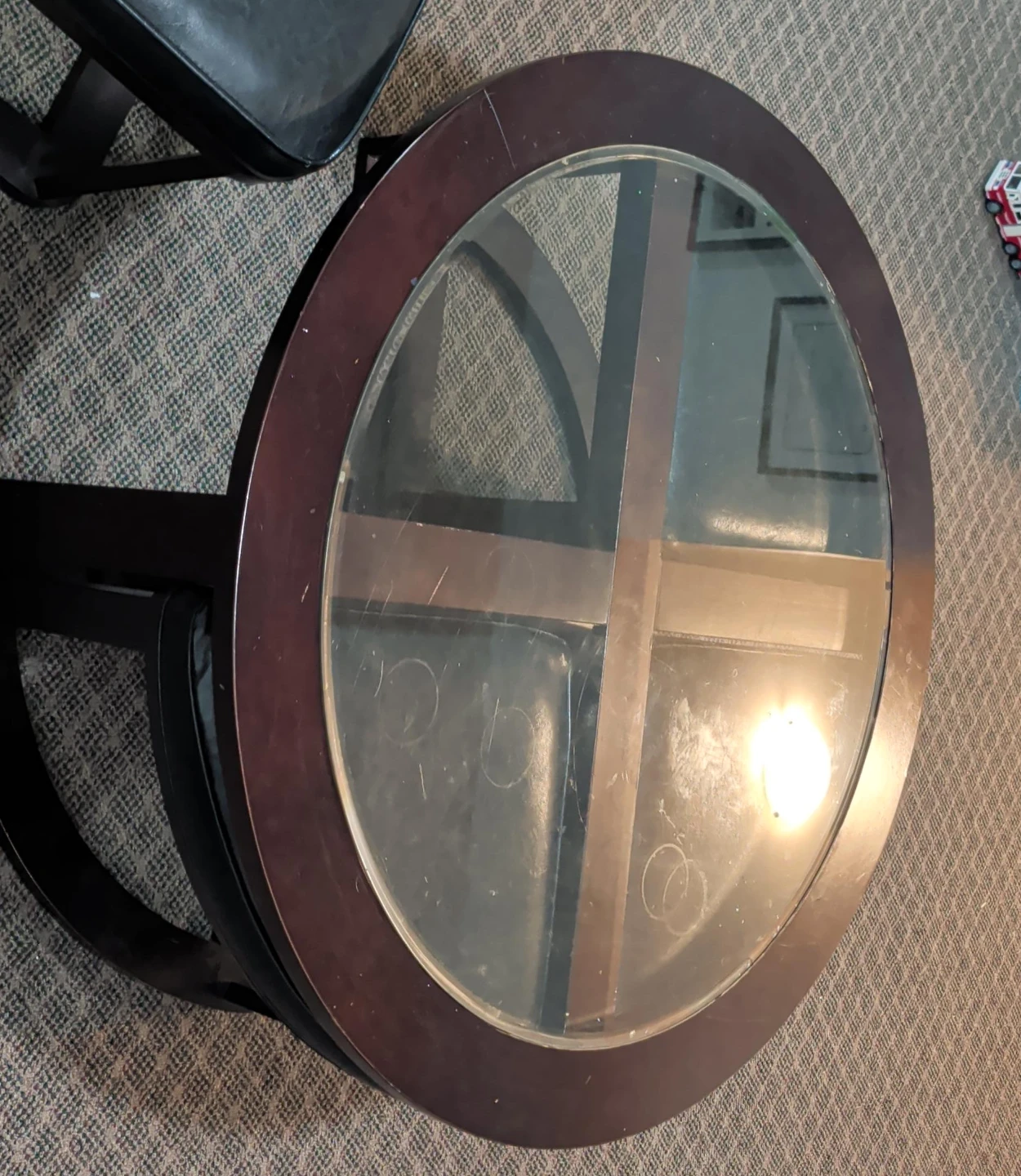 Round Glass Top Coffee Table with Dark Wood Trim