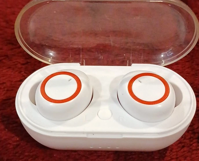 White Wireless Earbuds with Orange Accents
