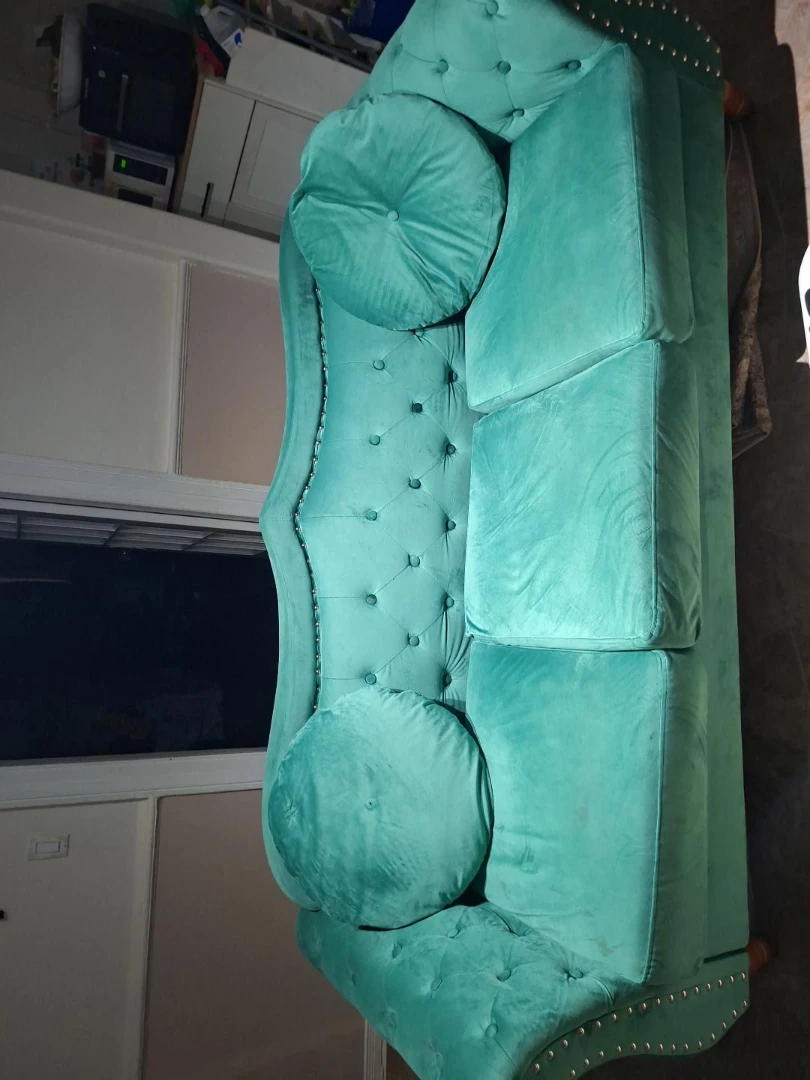 Turquoise Tufted Sofa with Round Pillows
