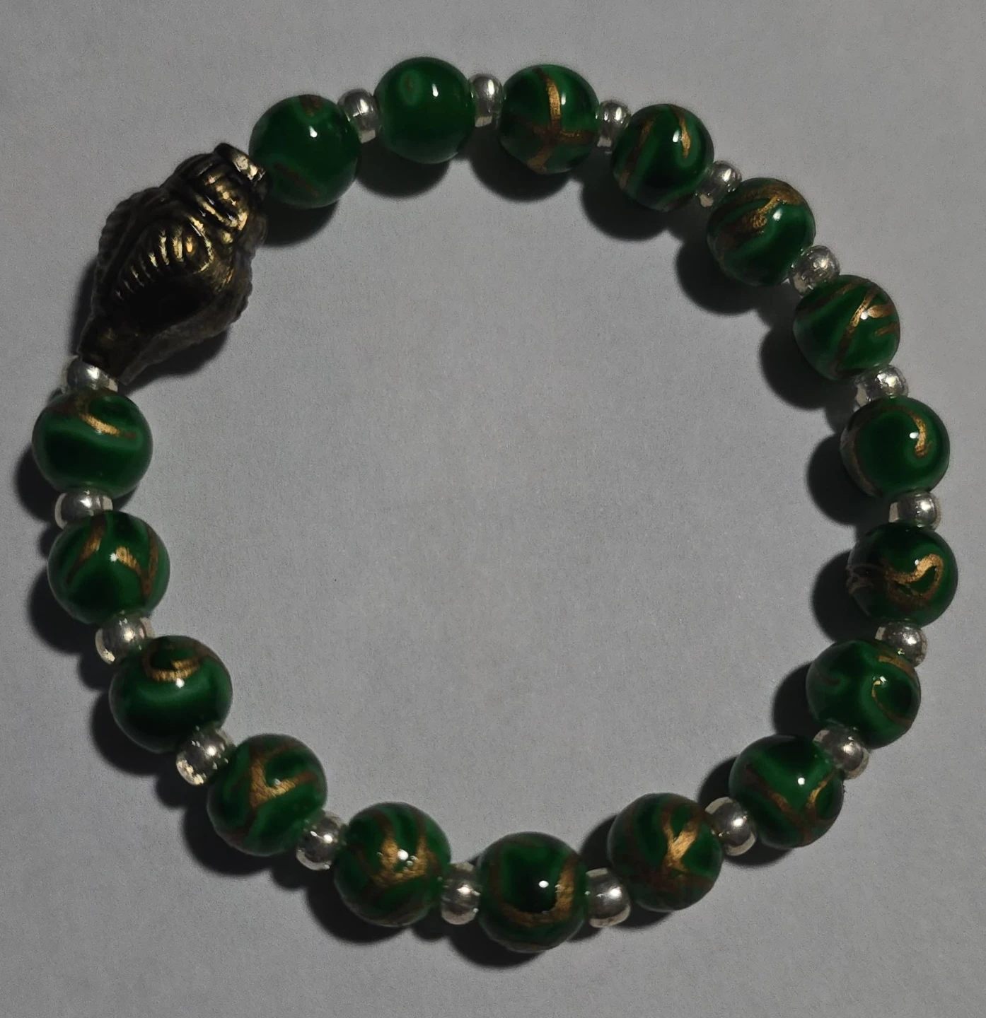 Green Beaded Bracelet with Buddha Charm