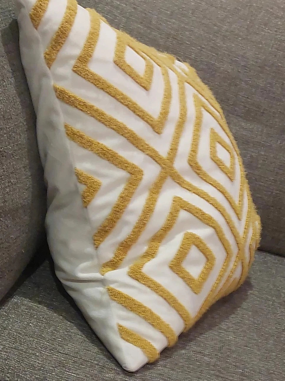 White Throw Pillow with Gold Geometric Pattern