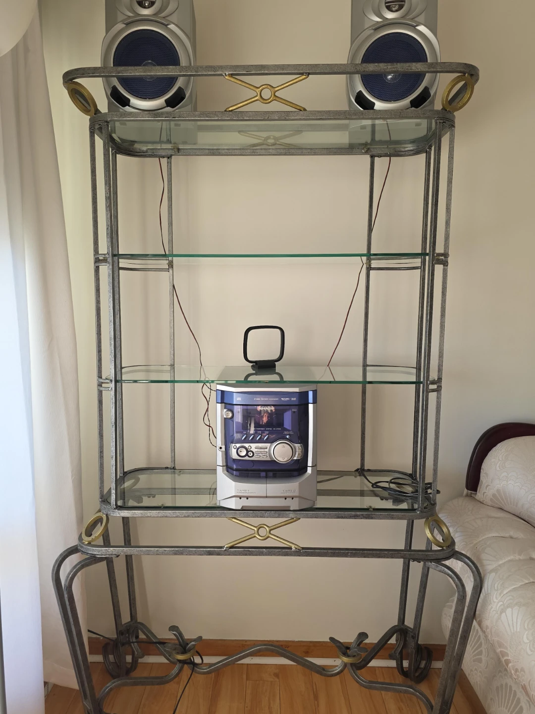 Silver and Glass Display Shelf with Speakers and Stereo System