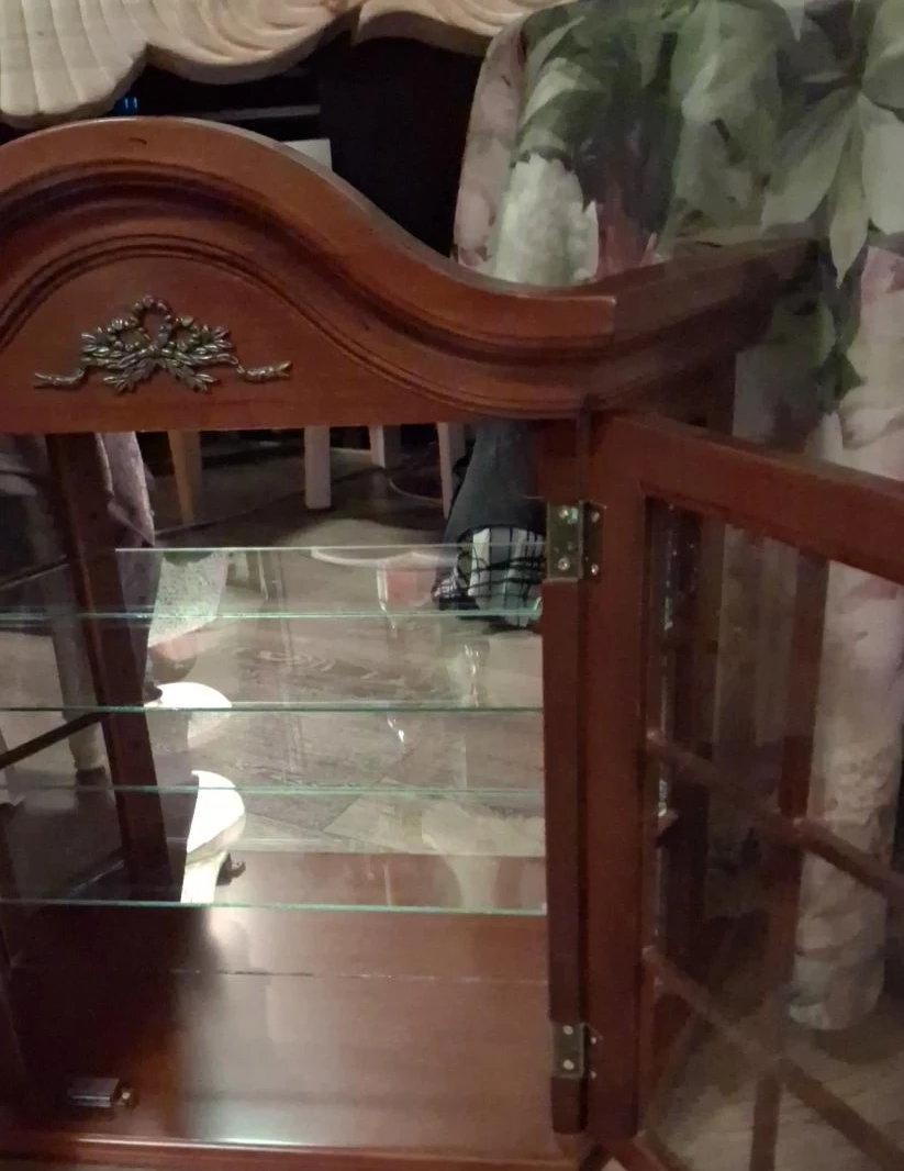 Wooden display cabinet with glass shelves