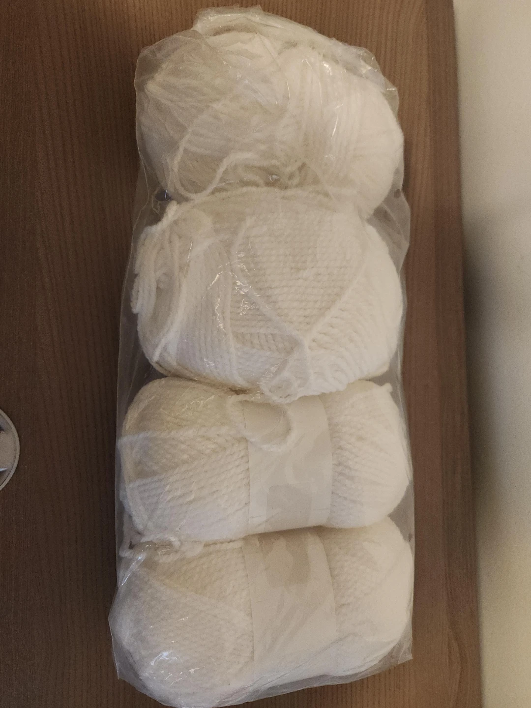 Four White Skeins of Yarn