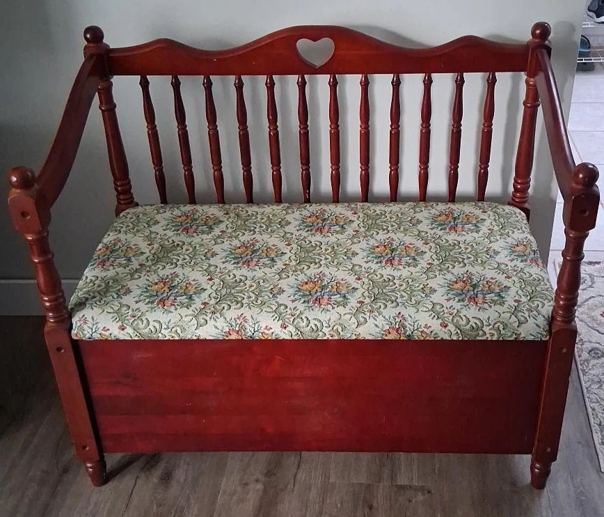 Wooden storage bench with floral cushion