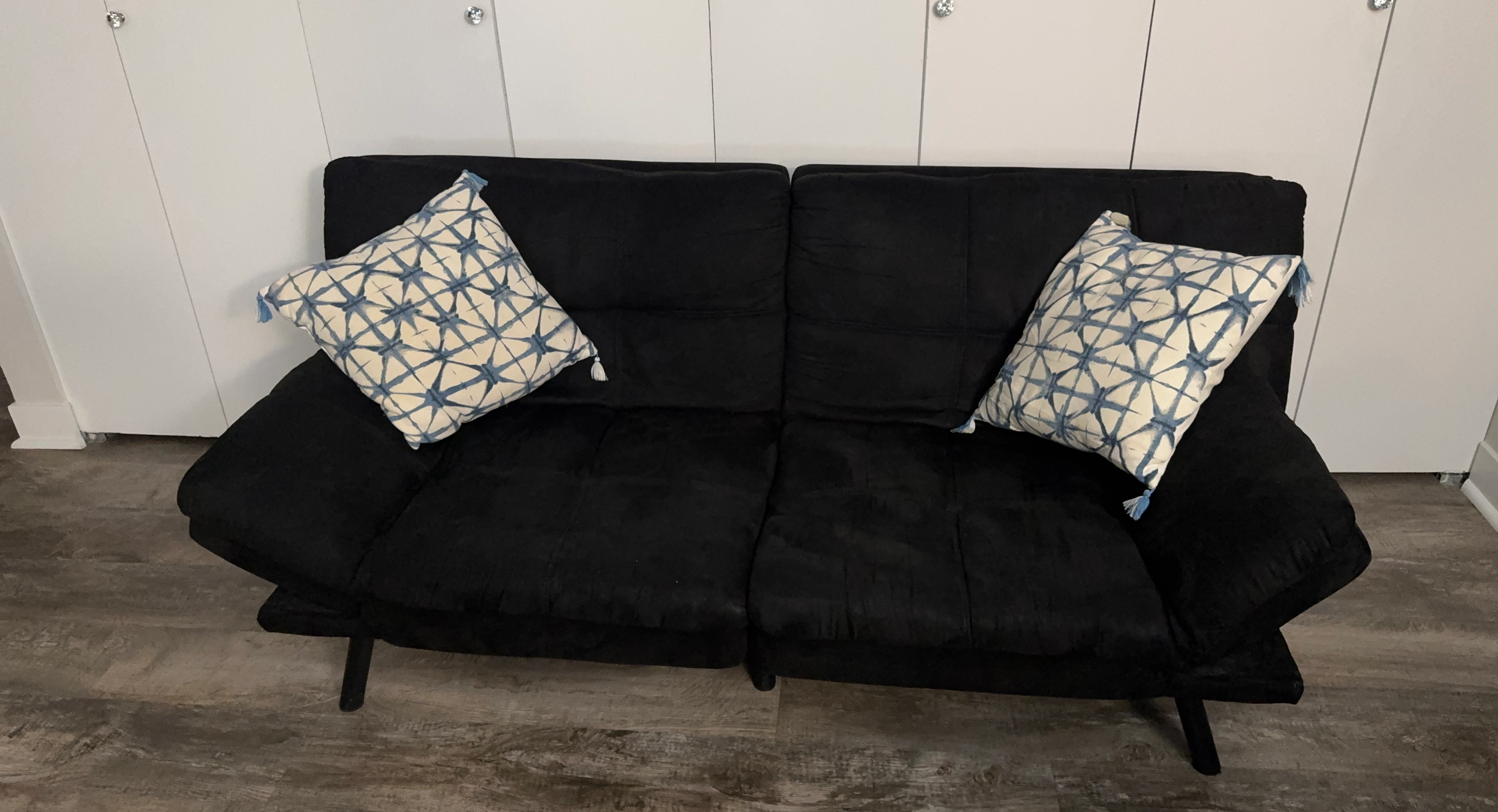 Black Futon Sofa with Decorative Pillows