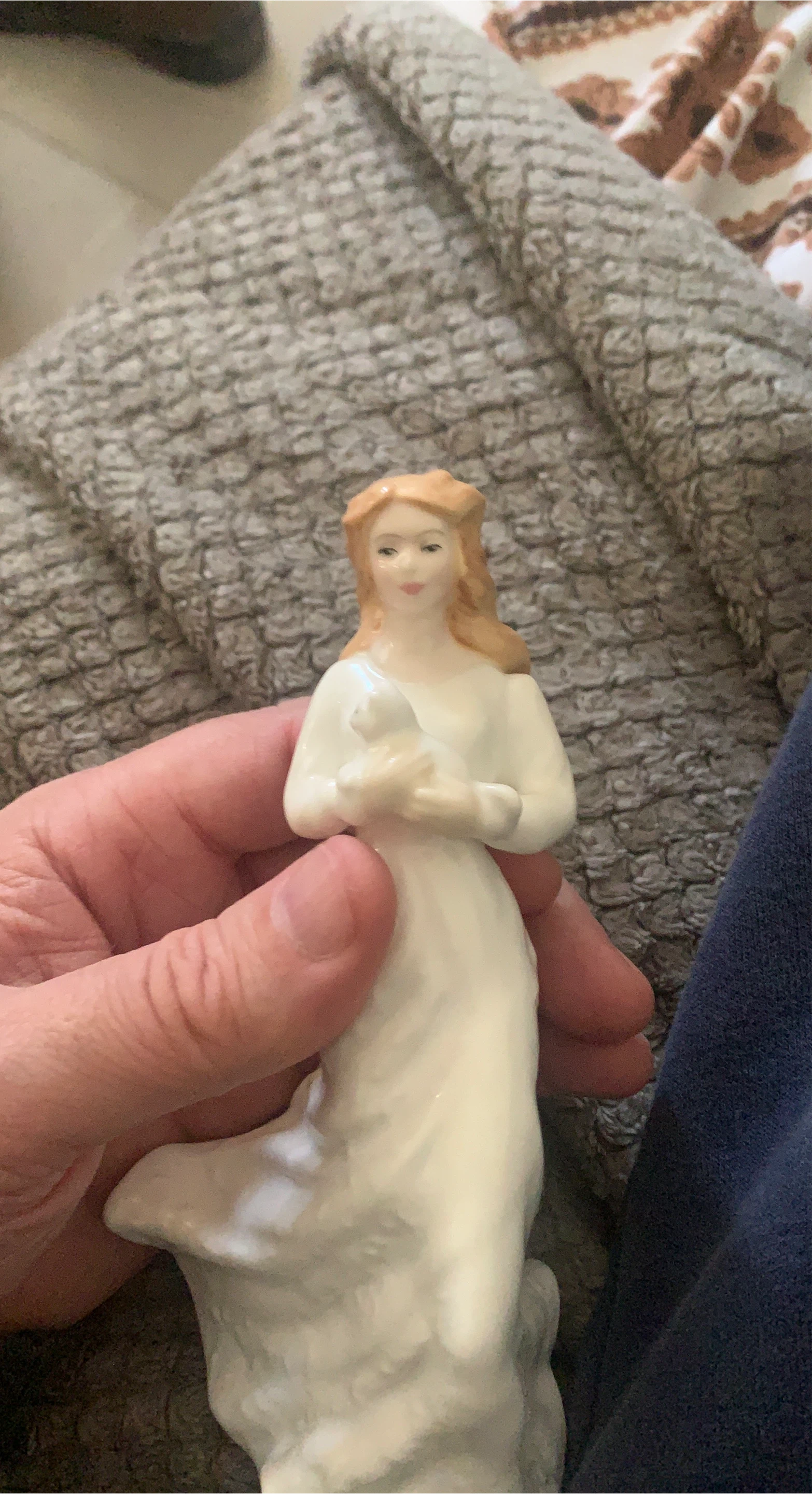Ceramic Figurine of a Woman Holding a Bird