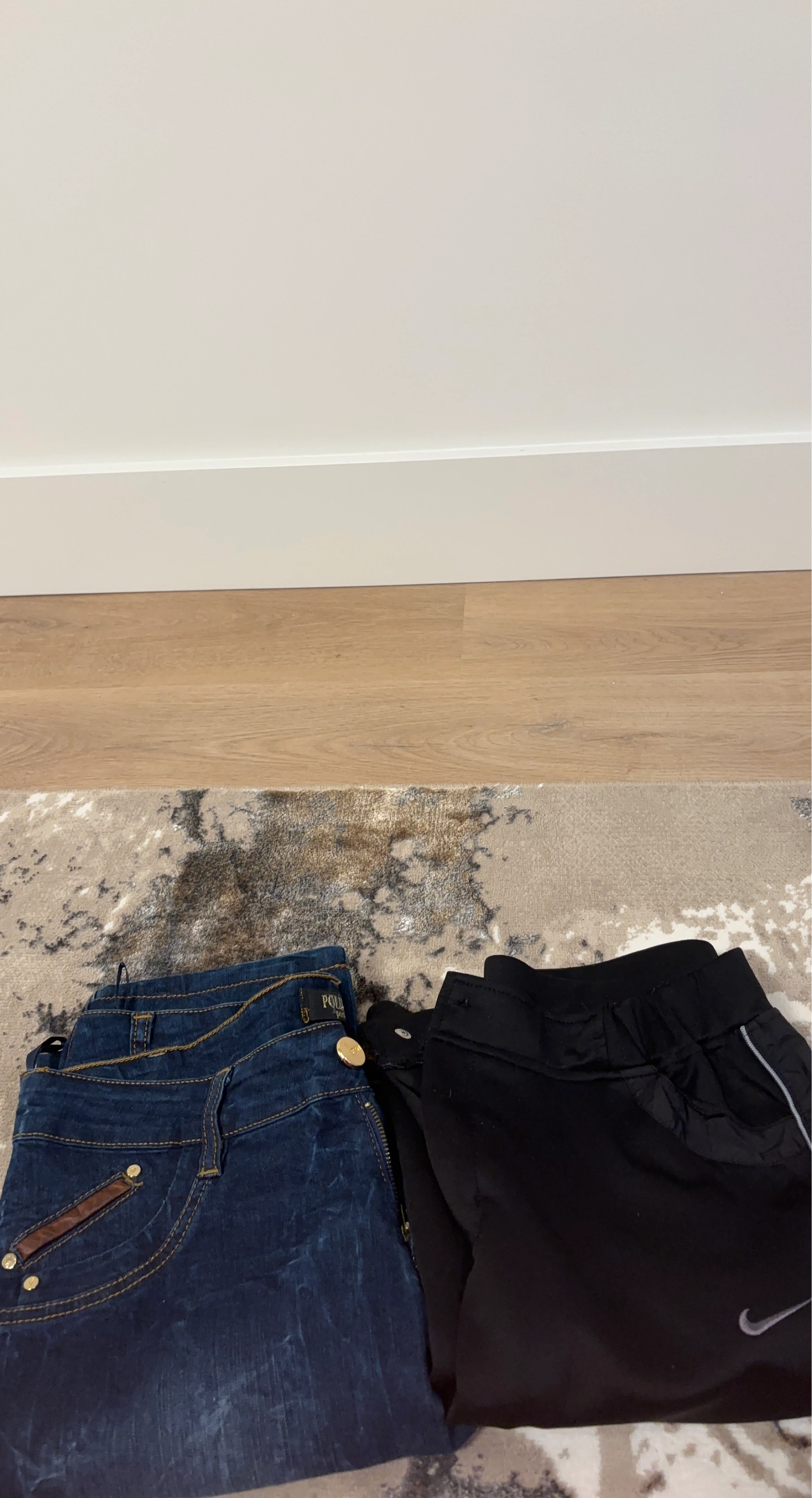 Pair of Jeans and Nike Pants