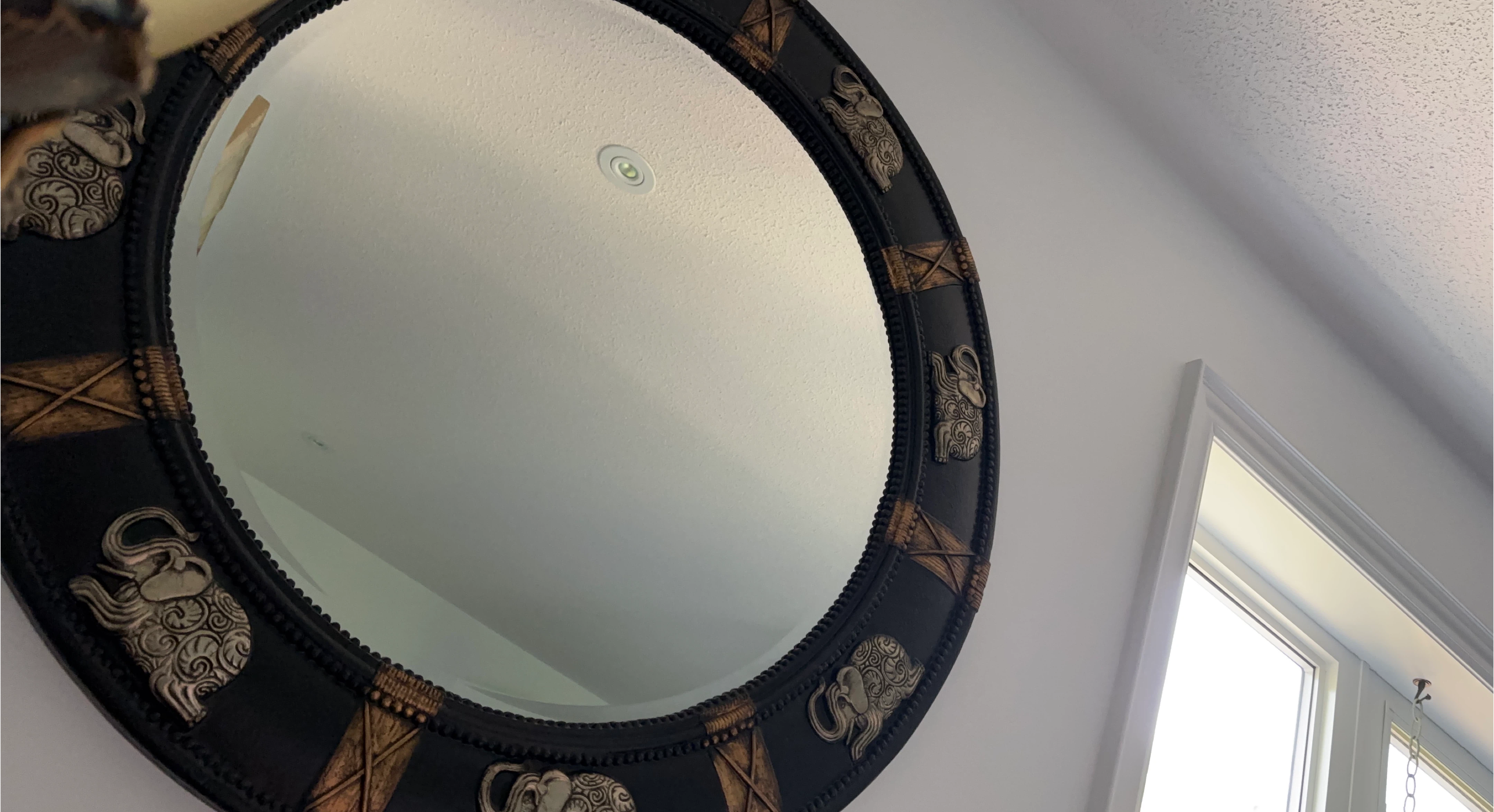 Decorative Round Mirror with Elephant Accents