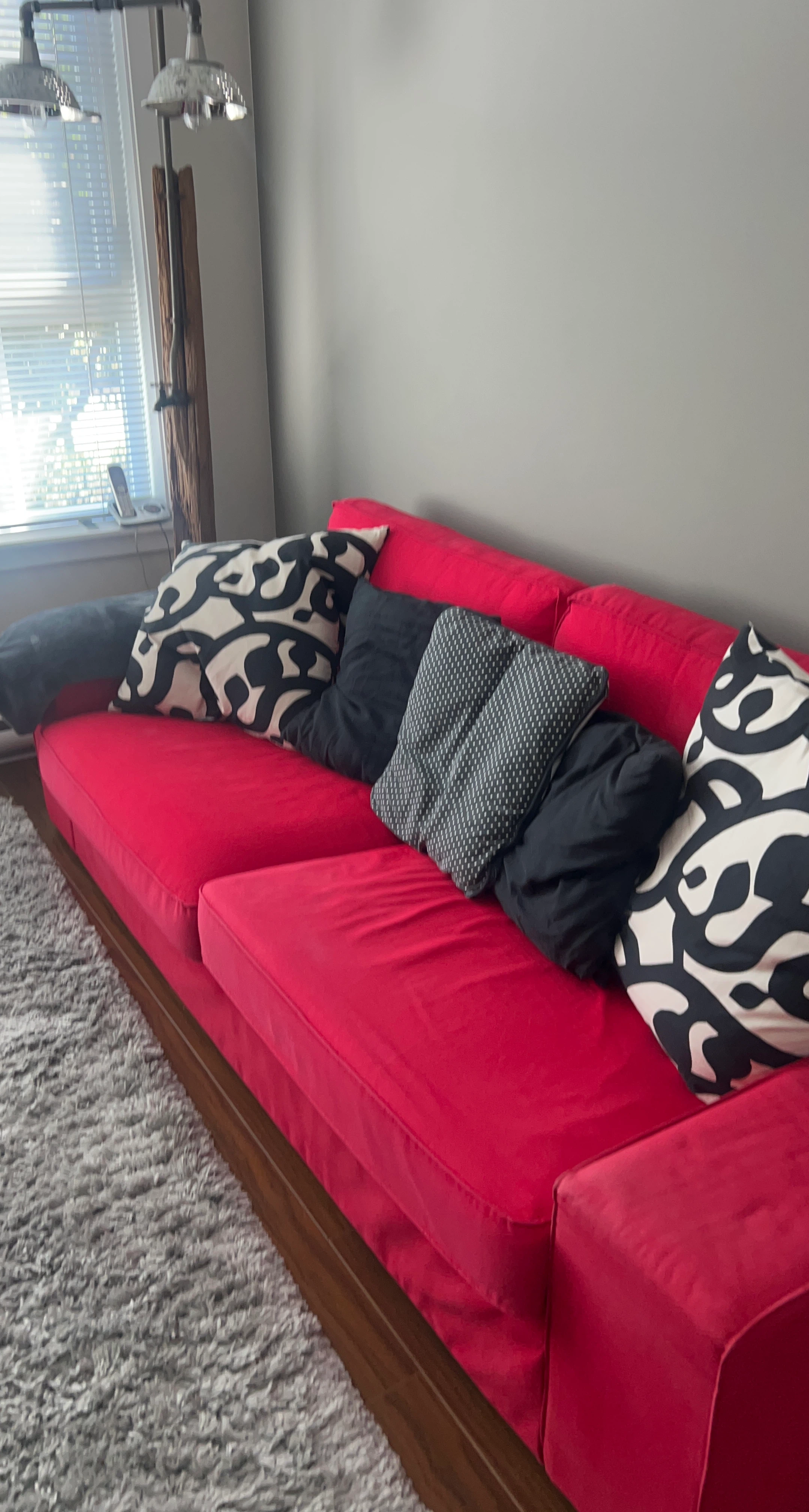 Red Sofa with Decorative Pillows