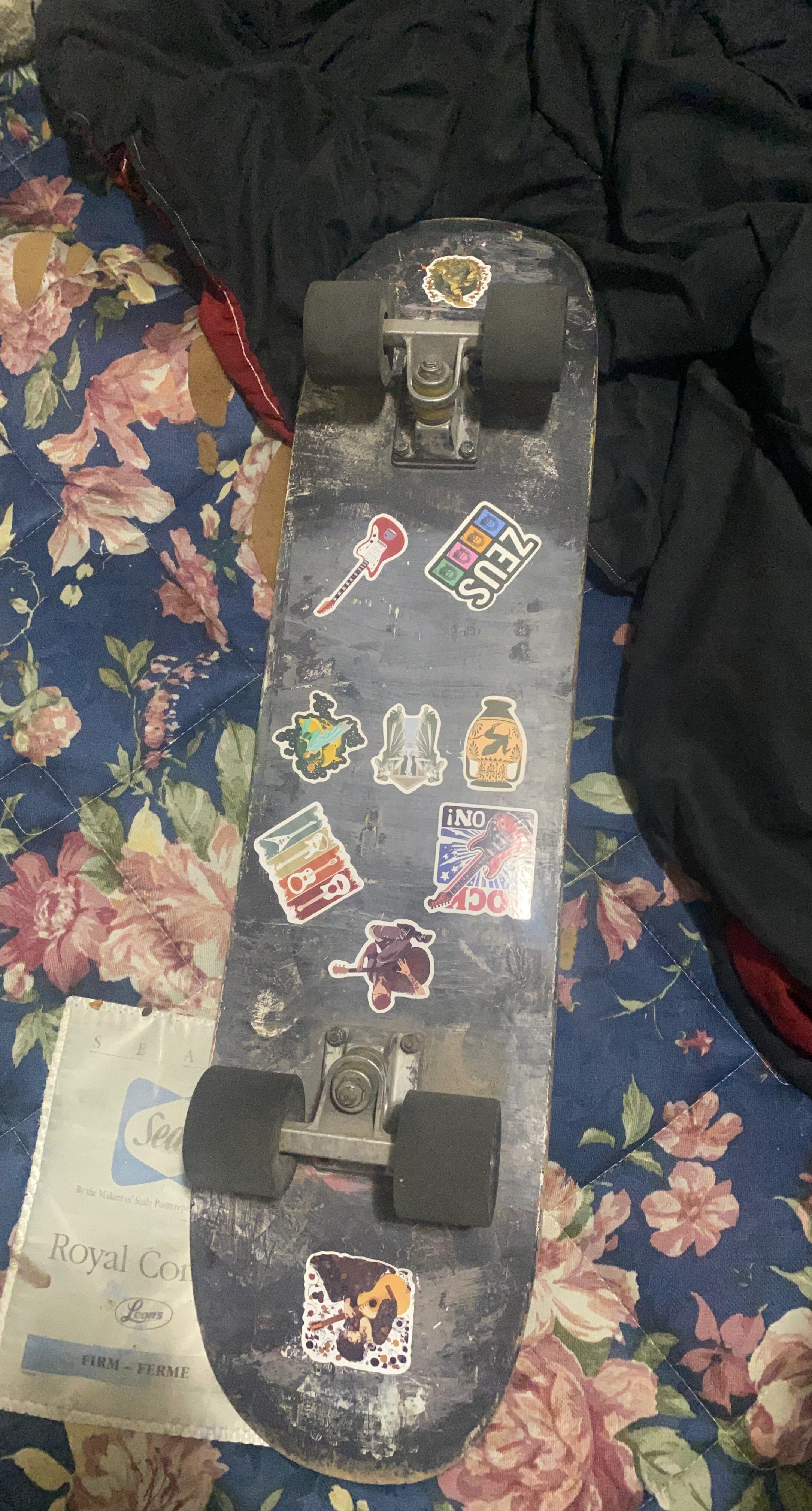 Used Skateboard with Stickers