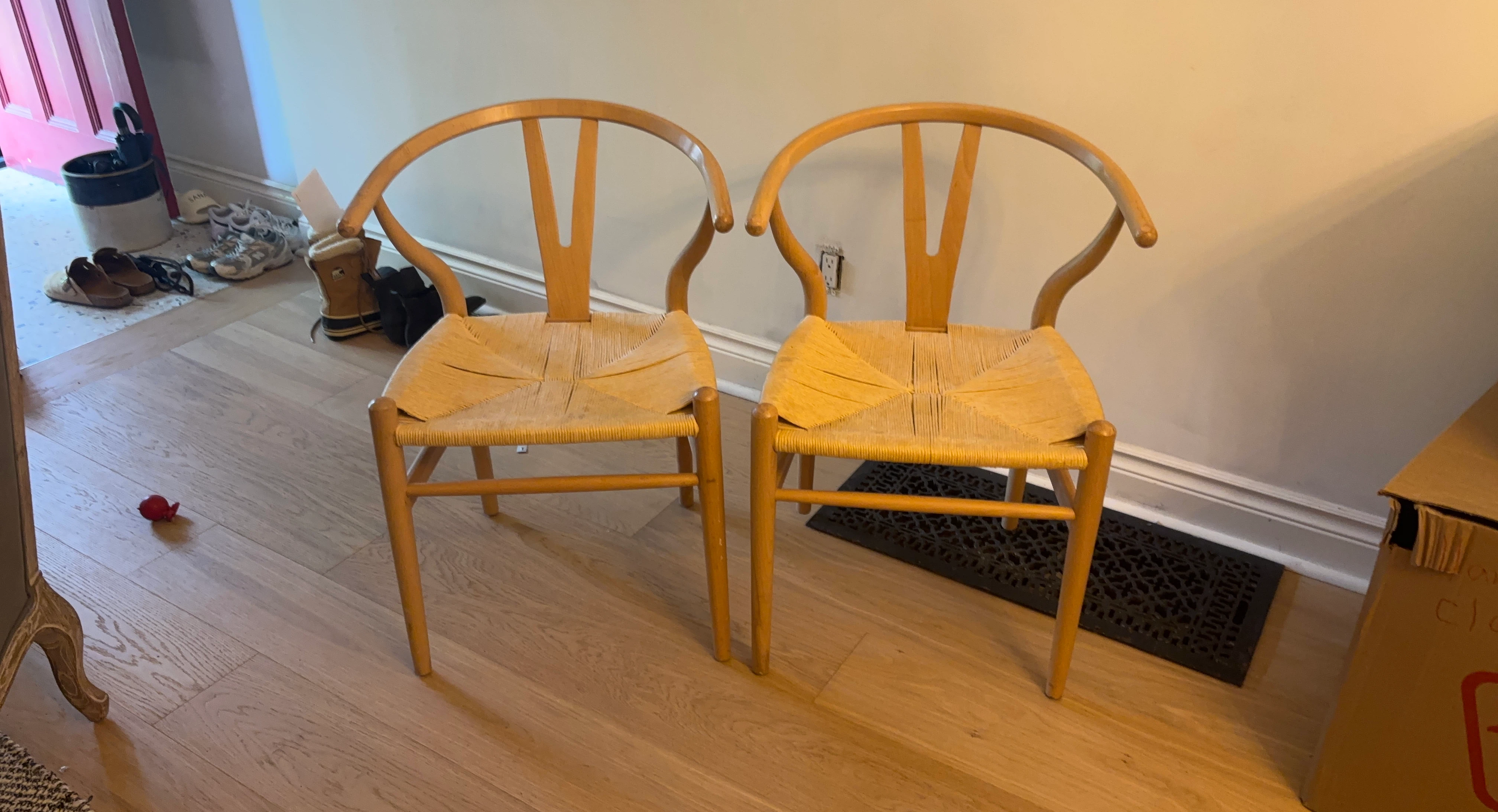 Pair of wooden chairs with woven seats